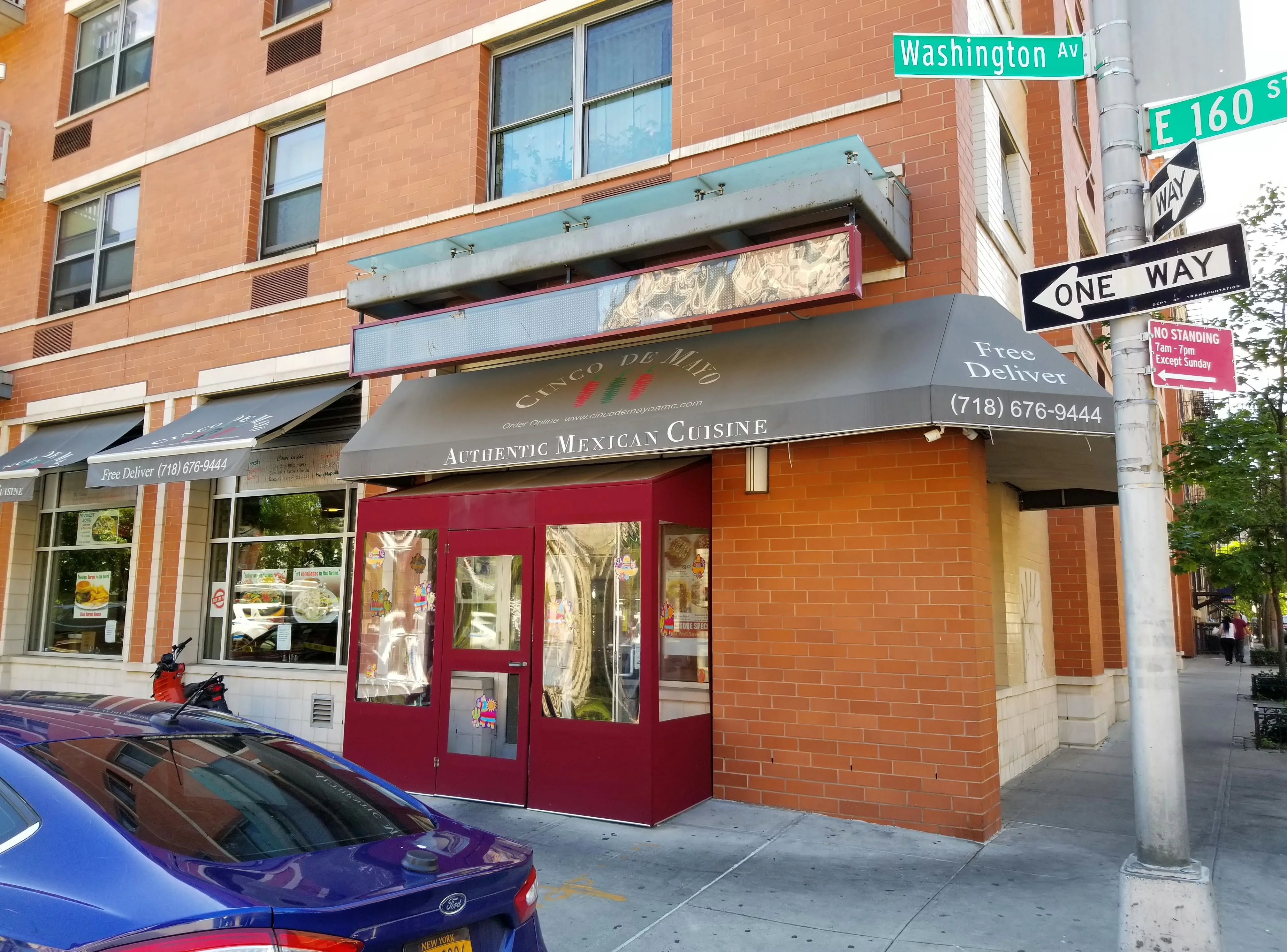 Exterior view of a Mexican restaurant with signage and delivery information