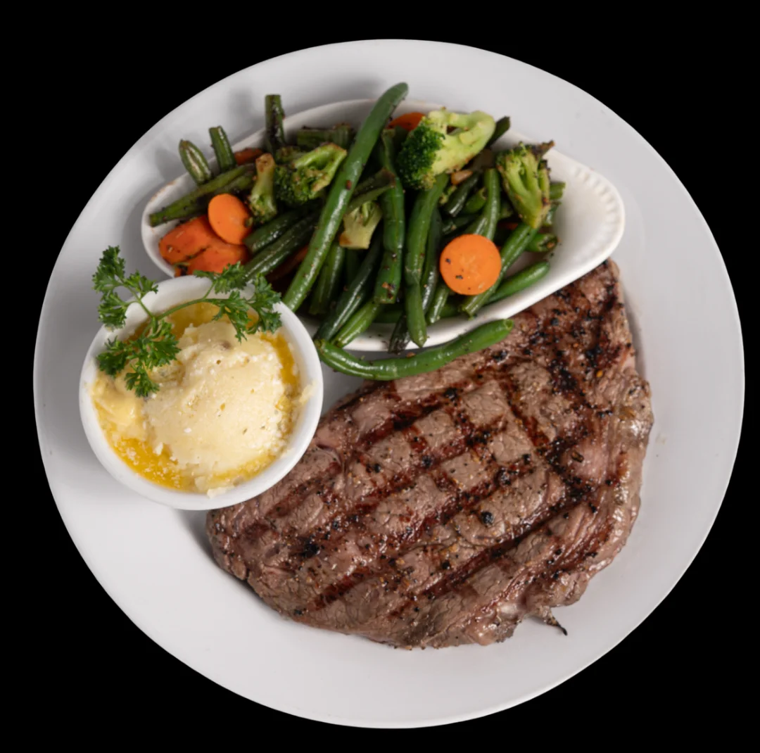 Grilled steak with vegetables and mashed potatoes