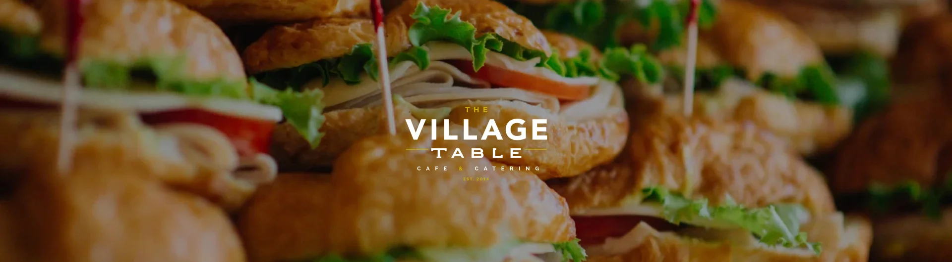 Delicious sandwiches stacked with fresh ingredients at The Village Table.