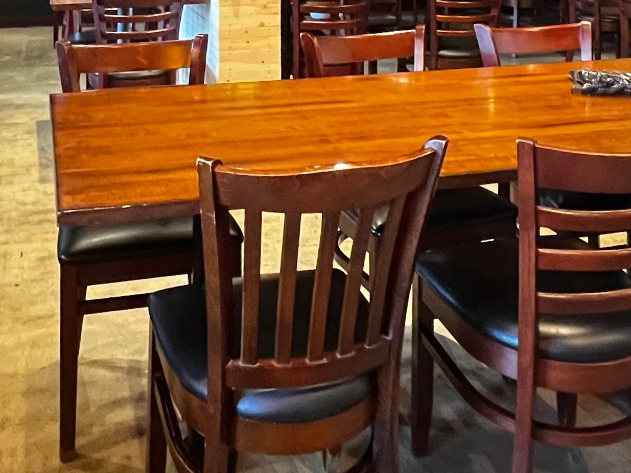 Cozy restaurant interior with wooden tables and warm lighting