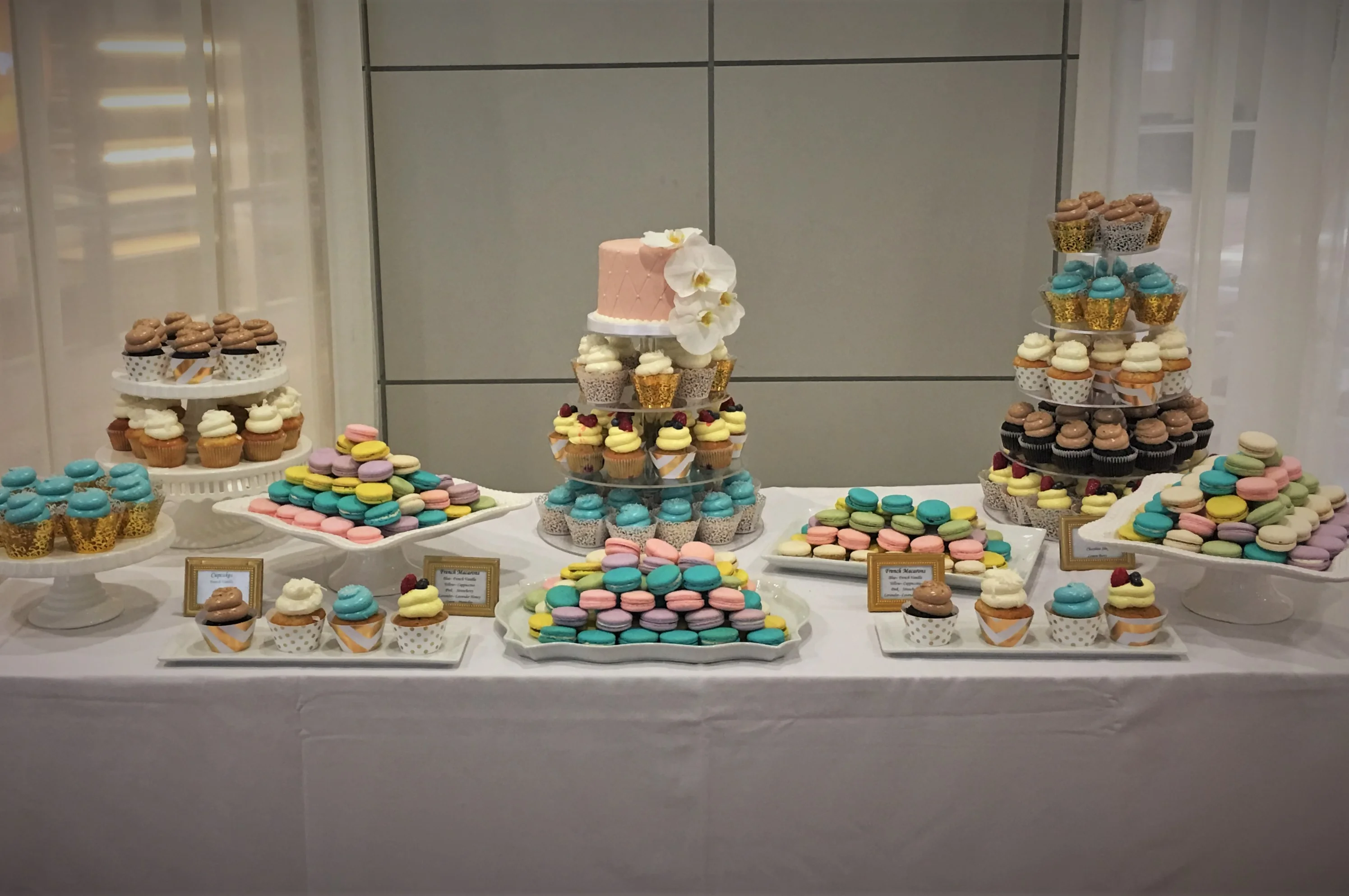 Colorful dessert display with cupcakes and macarons for a festive occasion