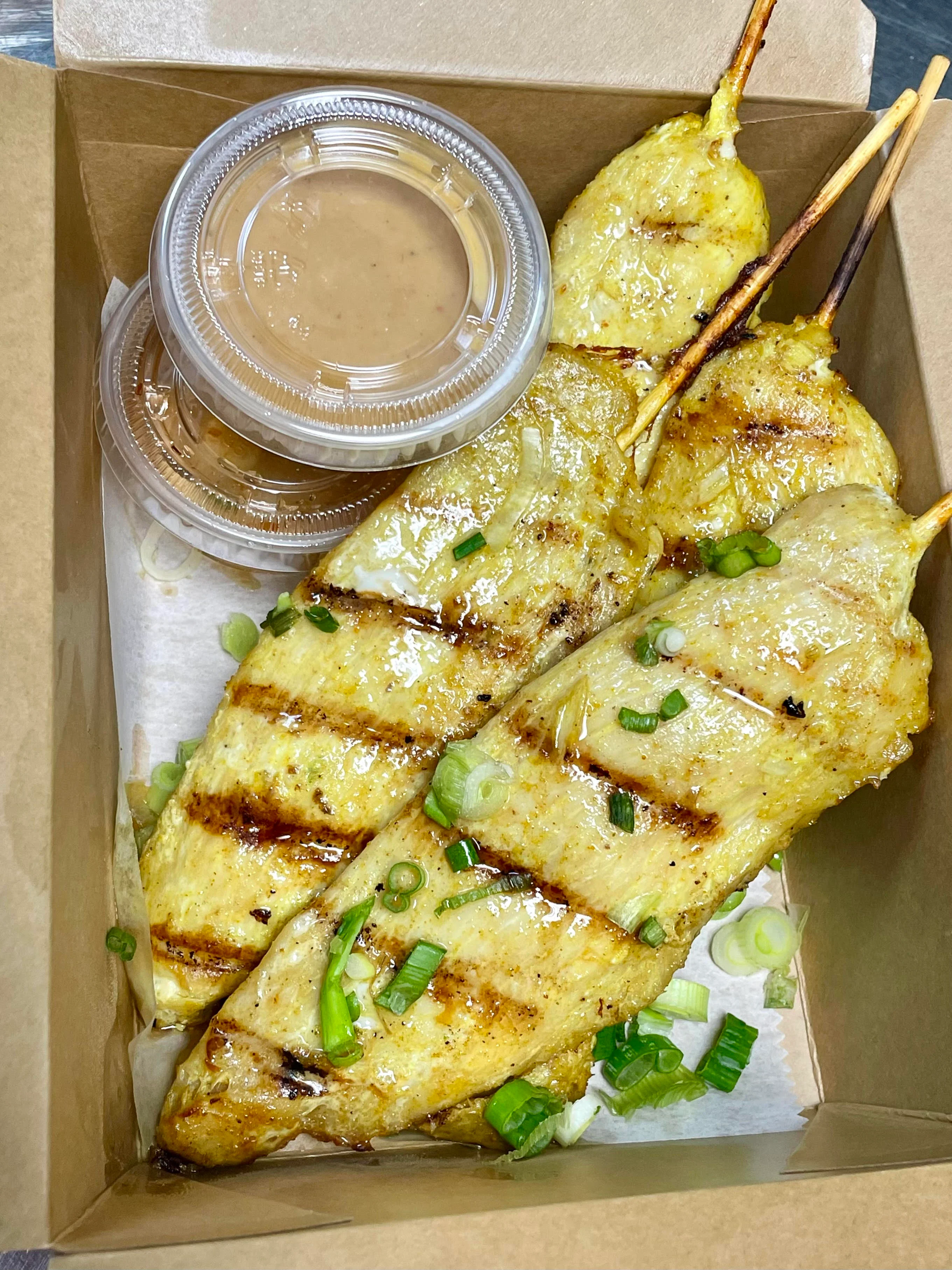 Grilled Thai beef satay skewers with peanut sauce