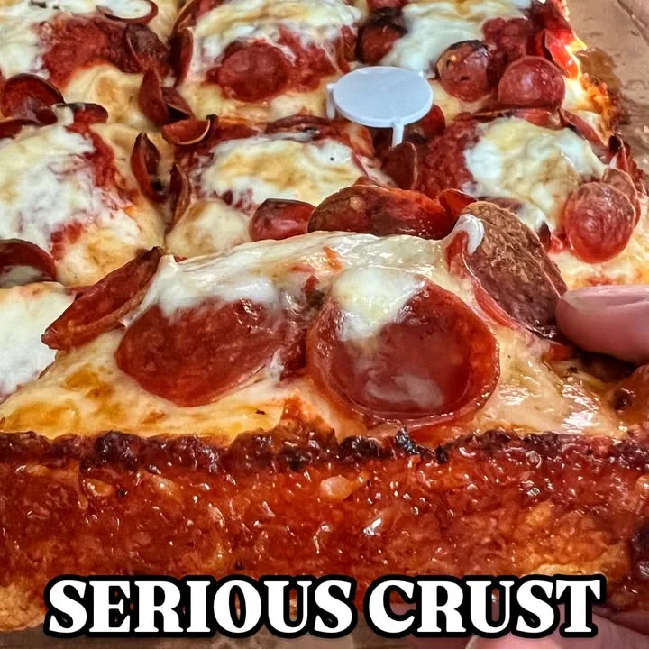 Deep-dish pepperoni pizza with a crispy crust
