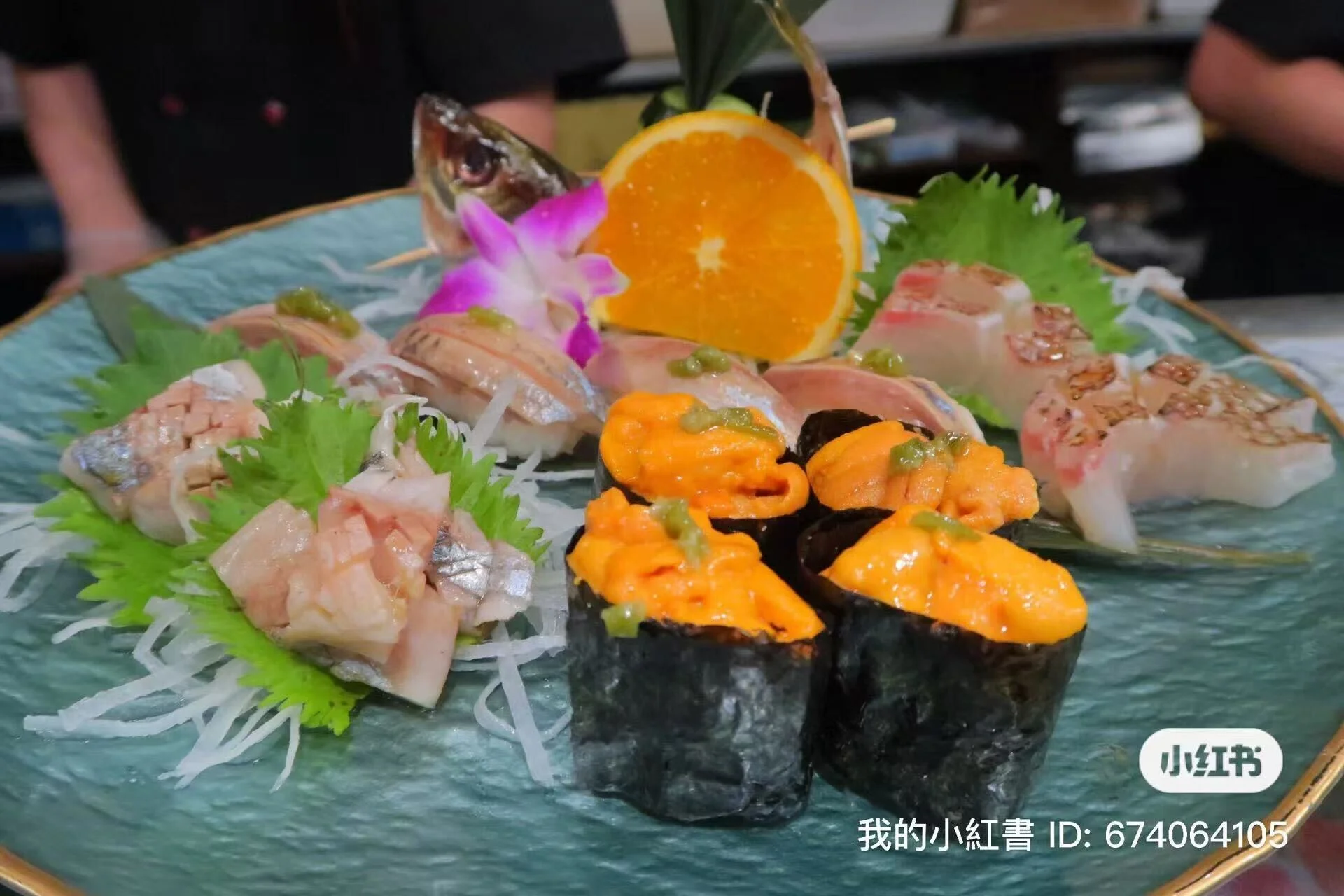 Assorted Japanese sushi platter with fresh sashimi and garnishes