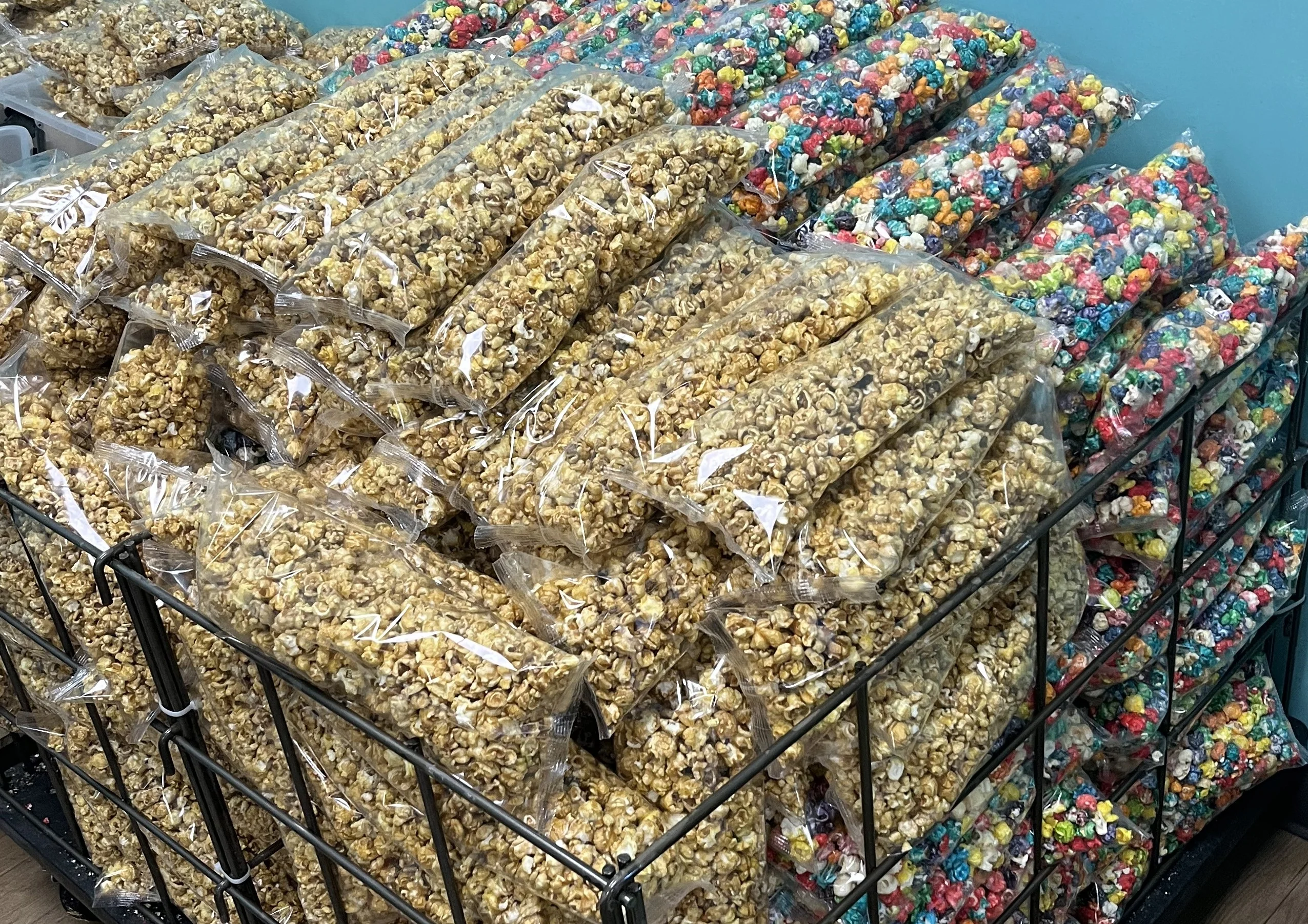 Colorful popcorn bags stacked in a display for sale
