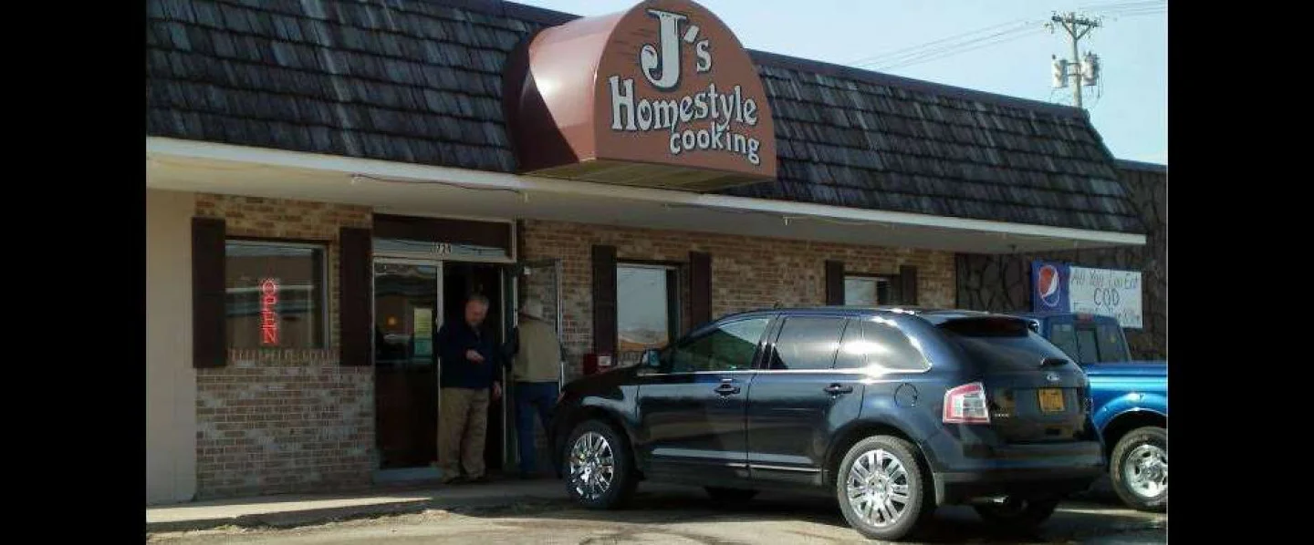Exterior of J's Homestyle Cooking restaurant with open sign