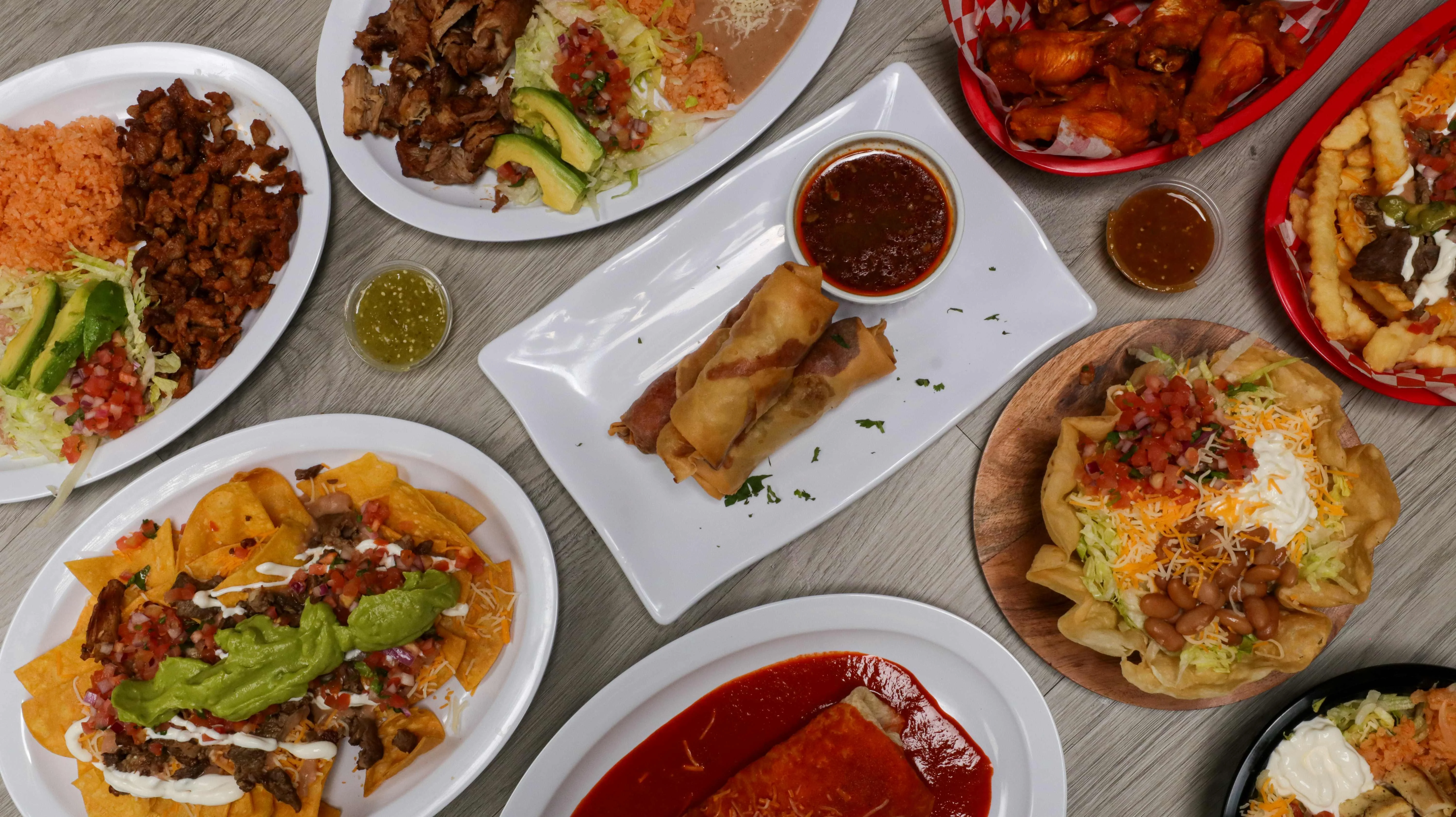 Colorful Mexican feast with nachos, tacos, and enchiladas