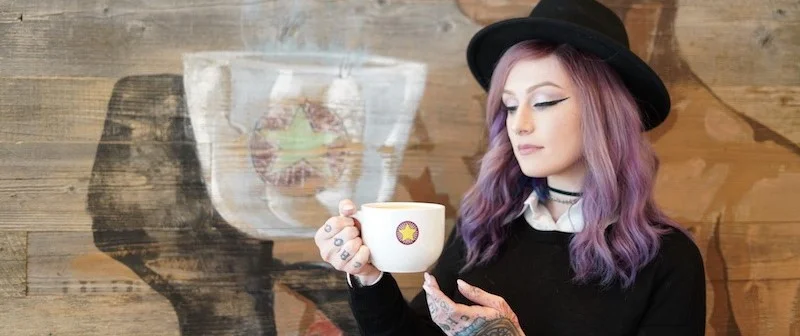 Woman enjoying coffee in a cozy café setting
