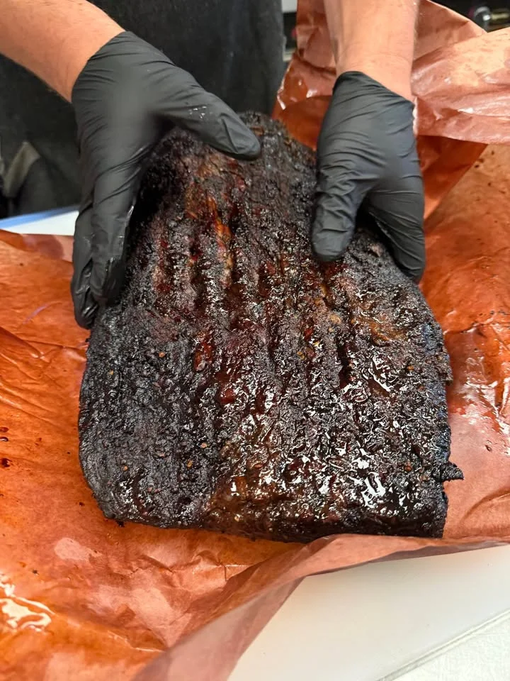 Smoked brisket wrapped in butcher paper