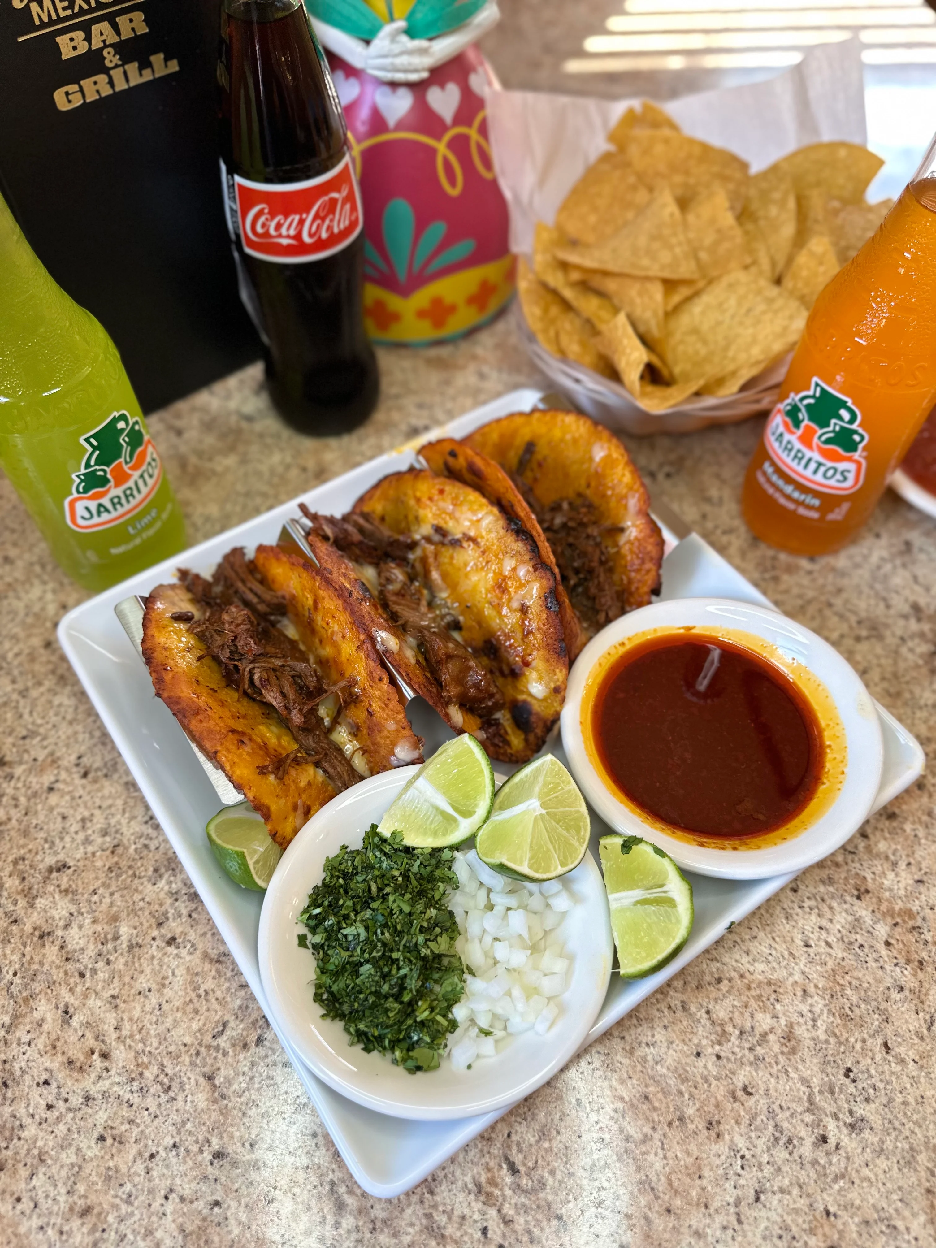 Delicious Mexican tacos al pastor with lime and salsa