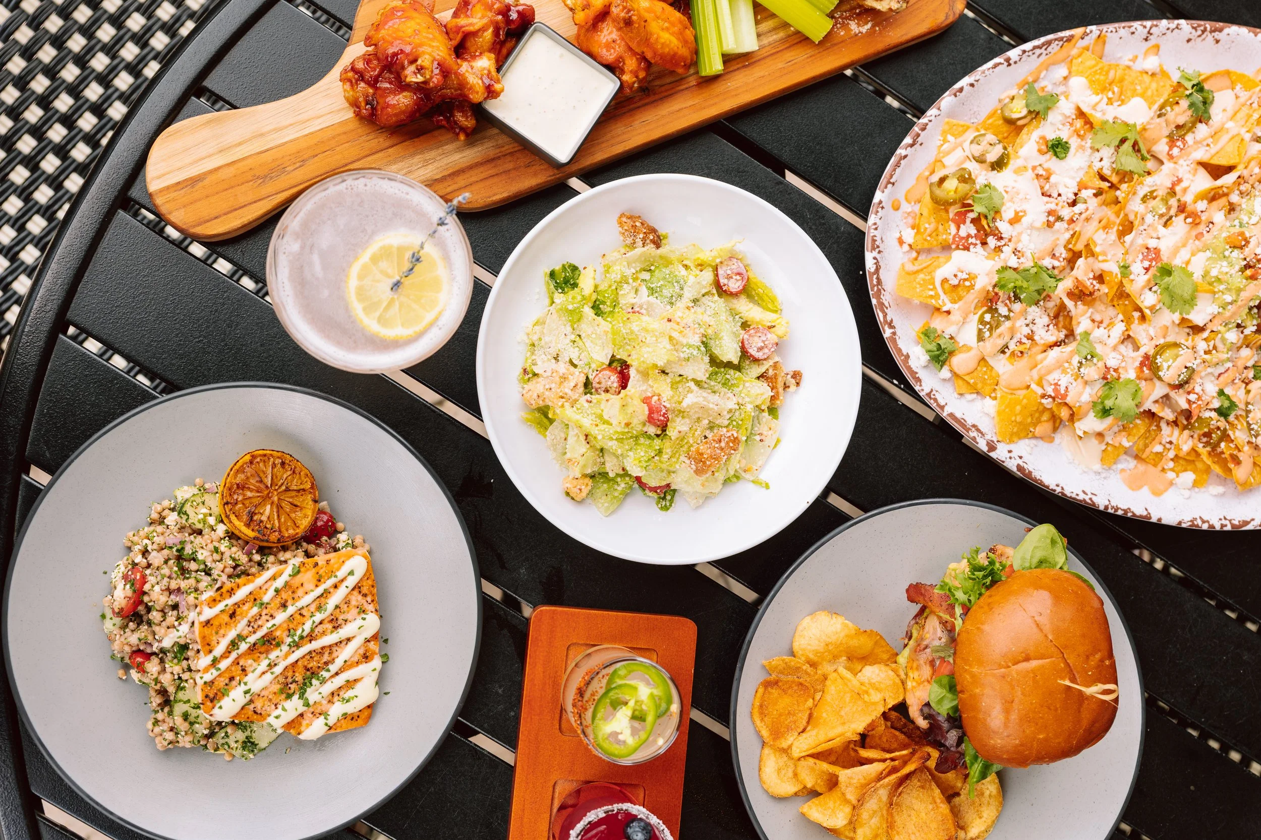 Assorted American pub dishes including wings and nachos