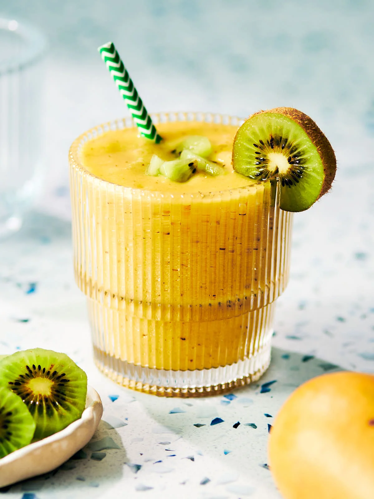 Tropical smoothie with kiwi and mango in a glass