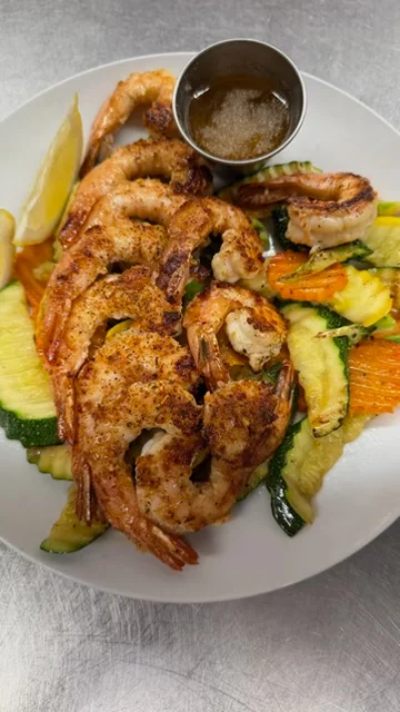 Grilled shrimp platter with seasonal vegetables