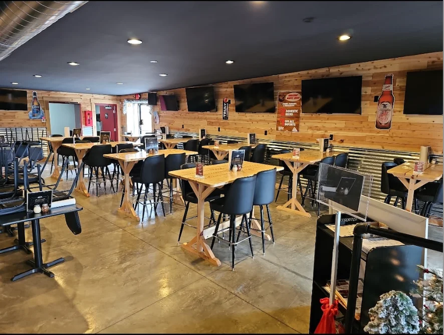 Cozy restaurant interior with wooden decor and tables
