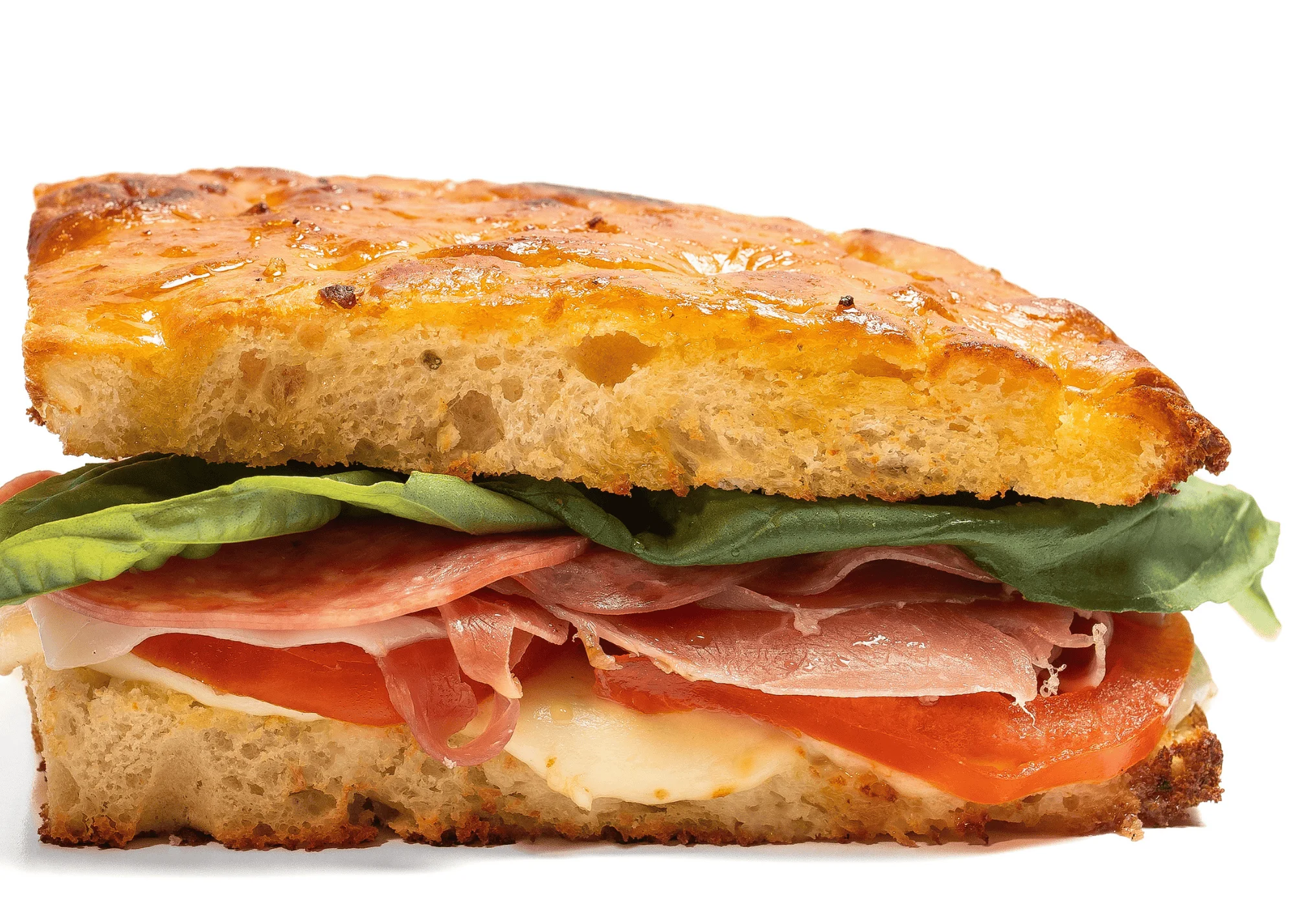 Italian panini sandwich with cured meats and fresh vegetables