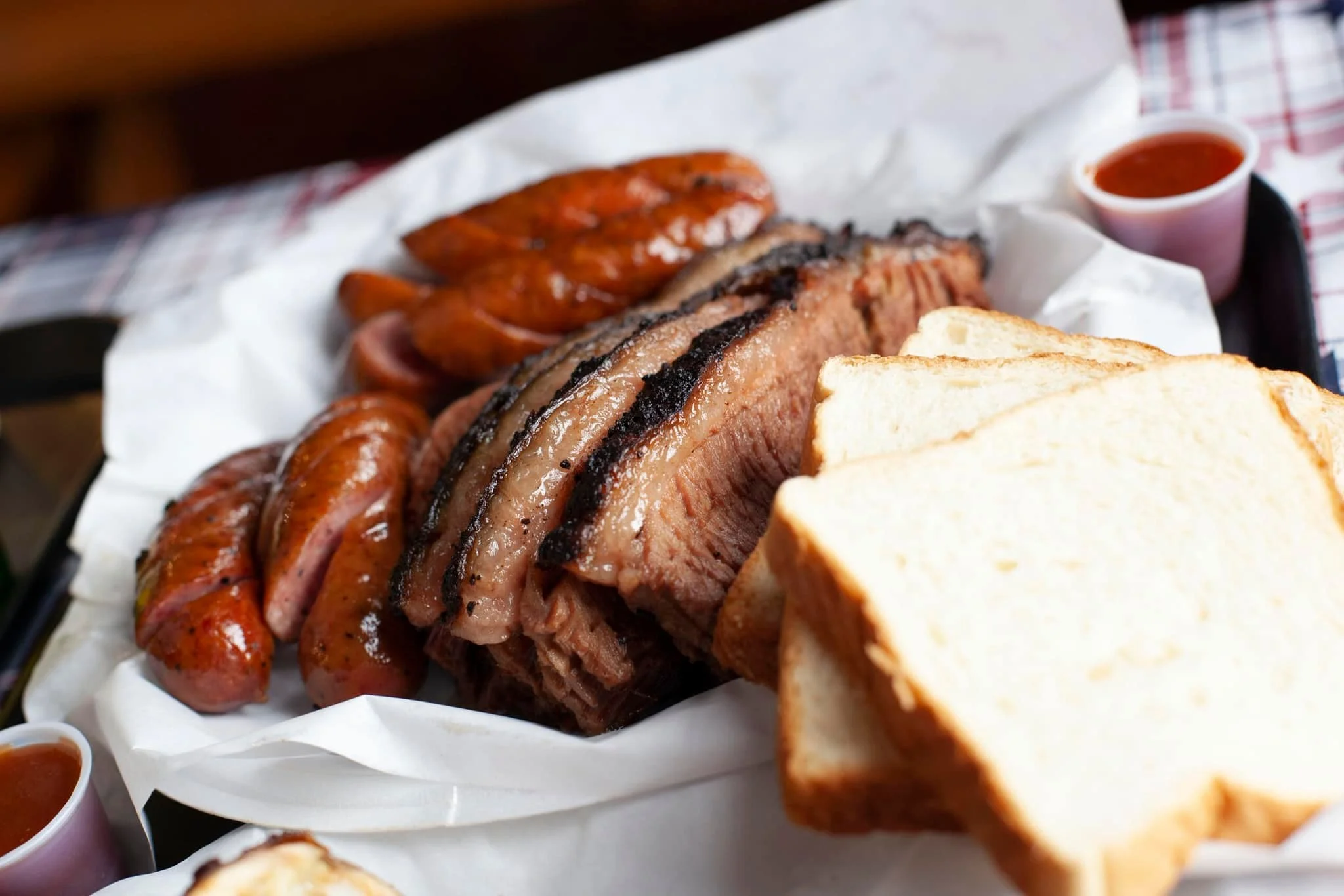 Smoked sausage and sliced brisket with bread from Rusty Bucket BBQ