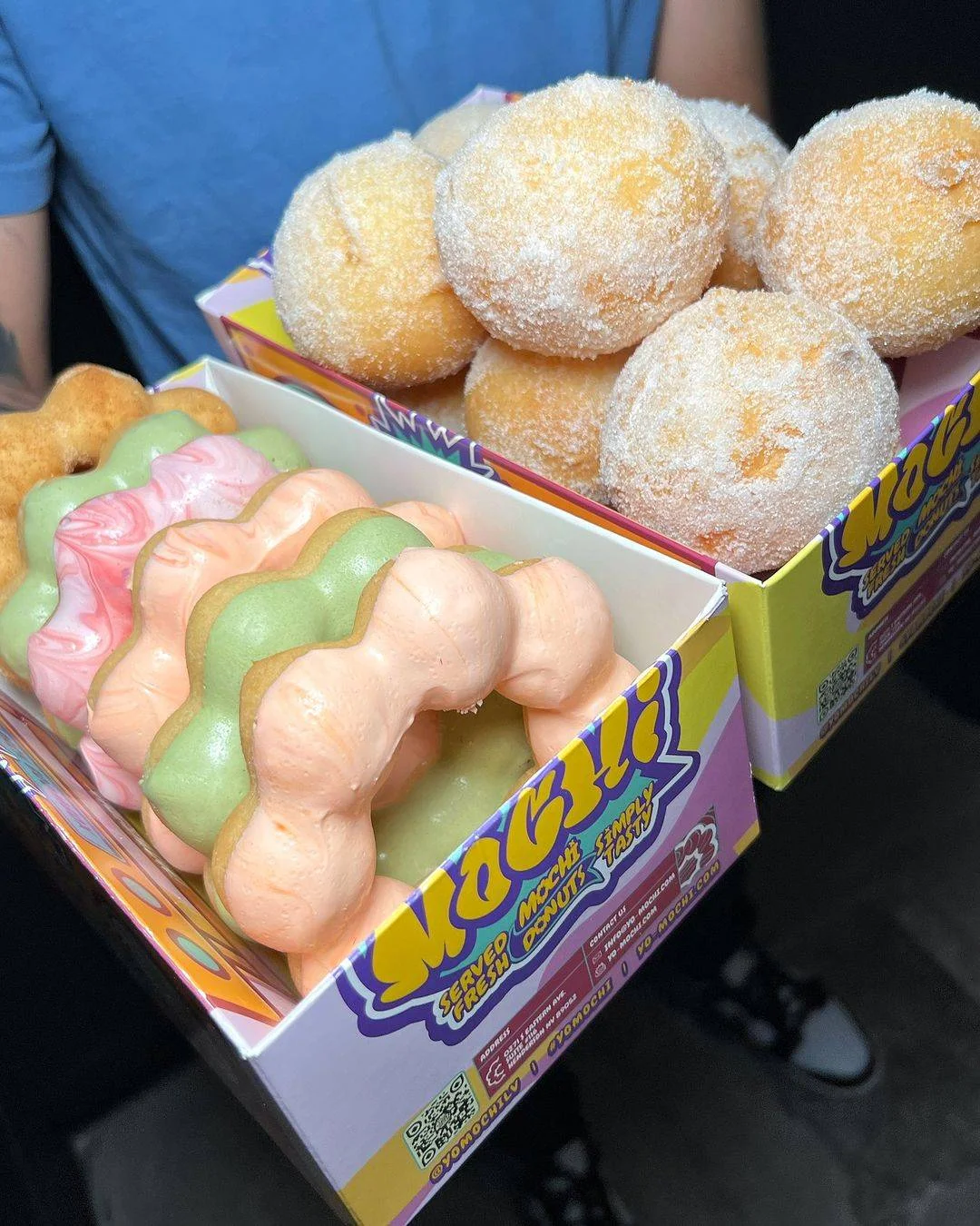 Colorful mochi donuts served in a box