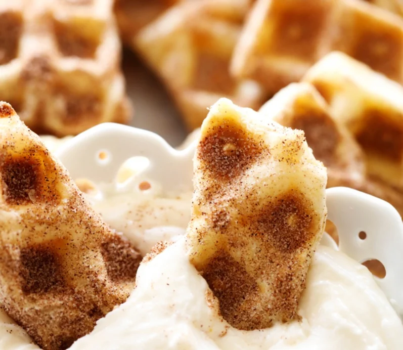 Crispy waffles served with creamy dip and cinnamon sugar