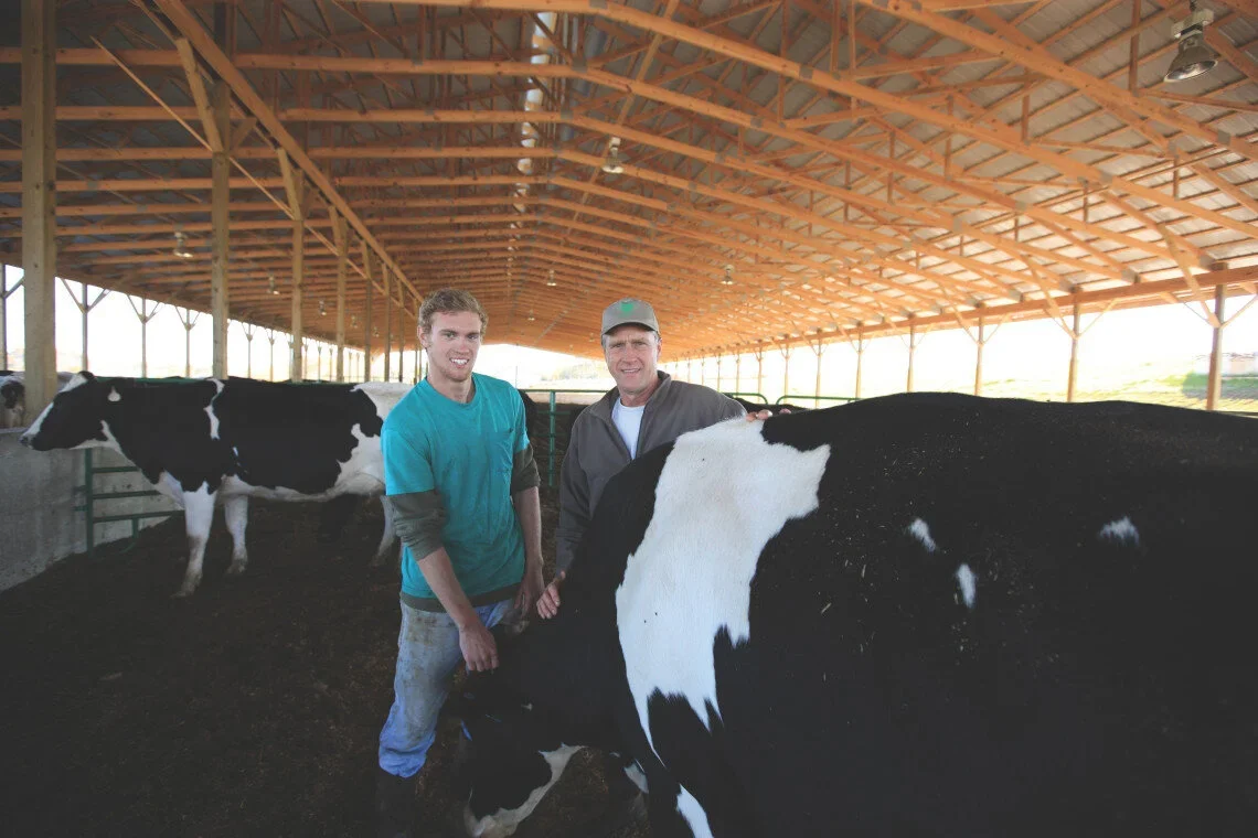Couple enjoying a large meal featuring Blue Meadow Beef.