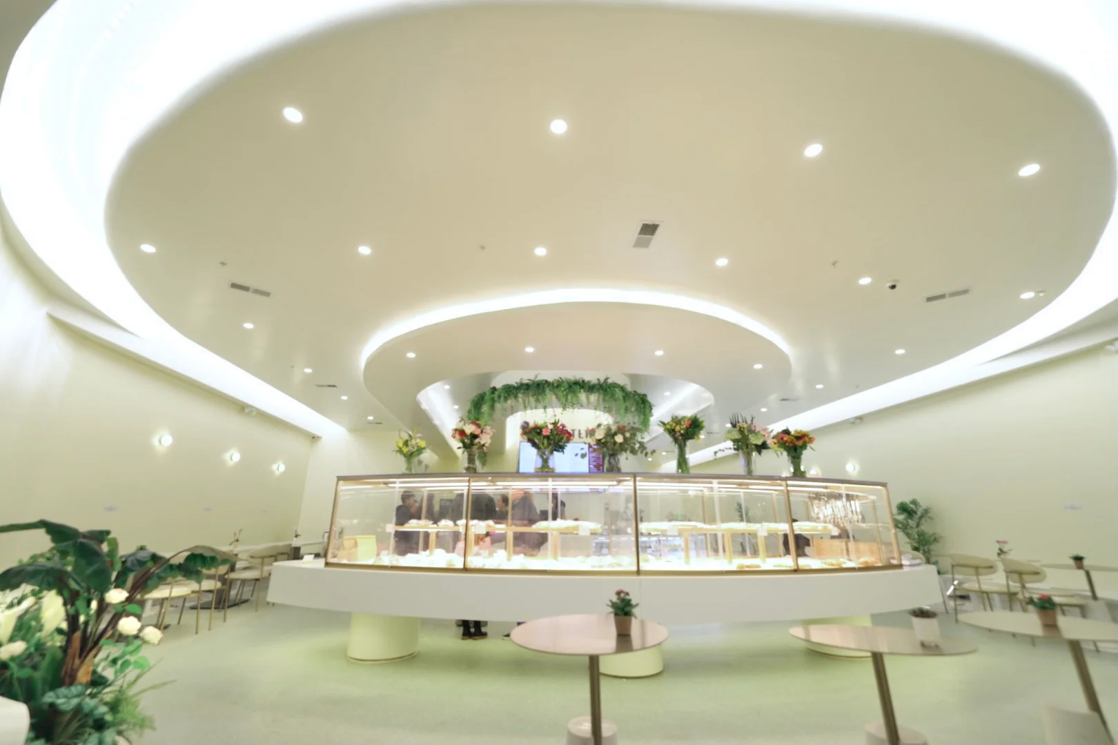 Modern dessert shop interior with elegant display cases