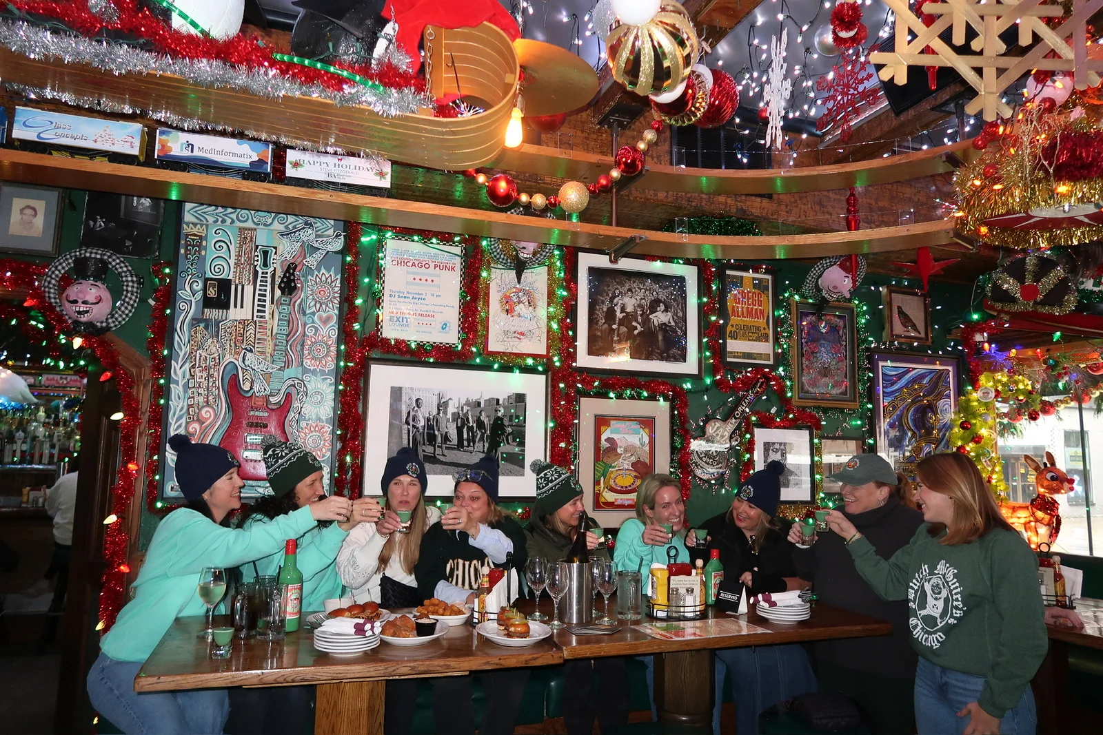Festive restaurant gathering with friends toasting drinks