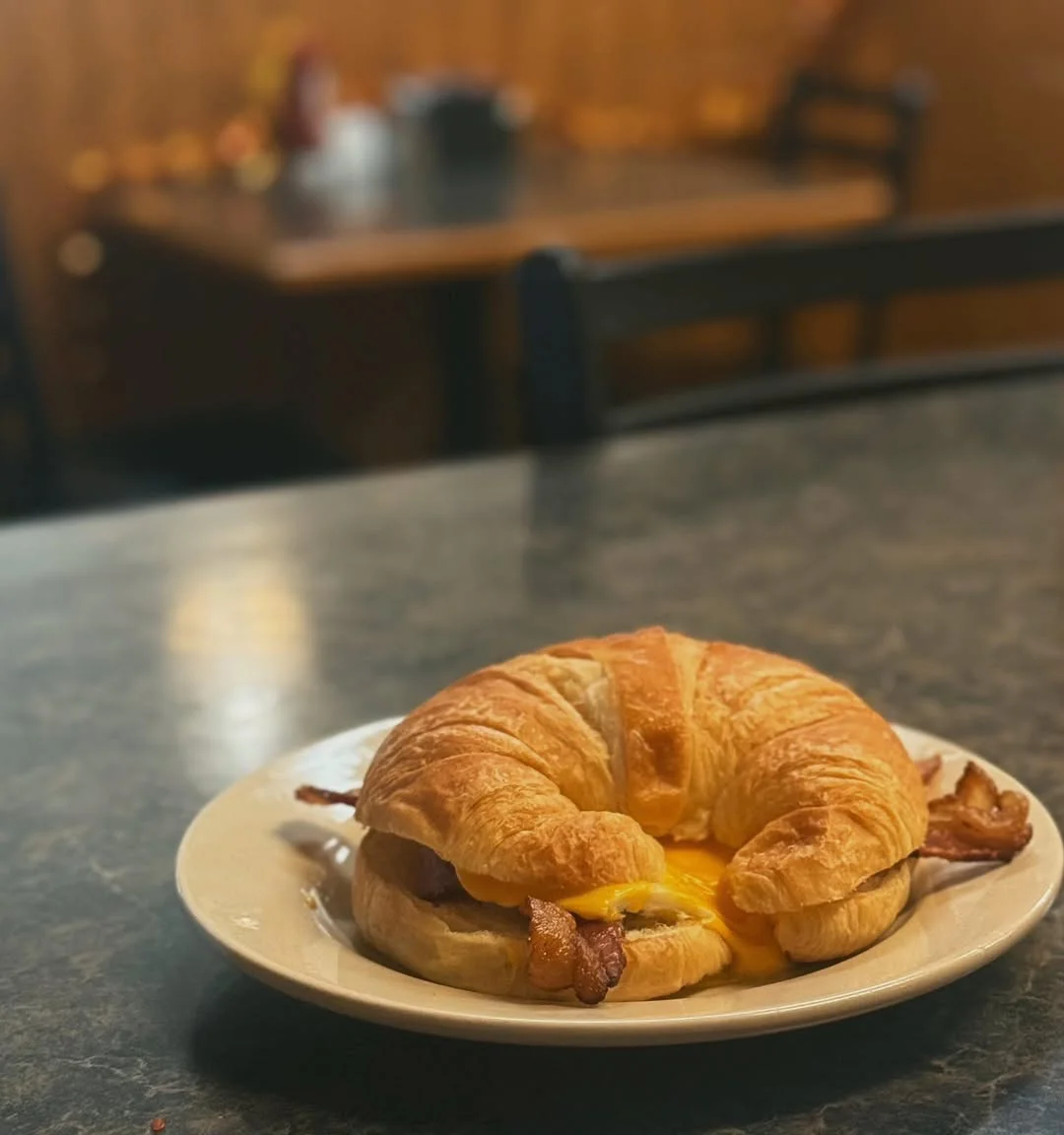 Croissant sandwich with bacon and cheese