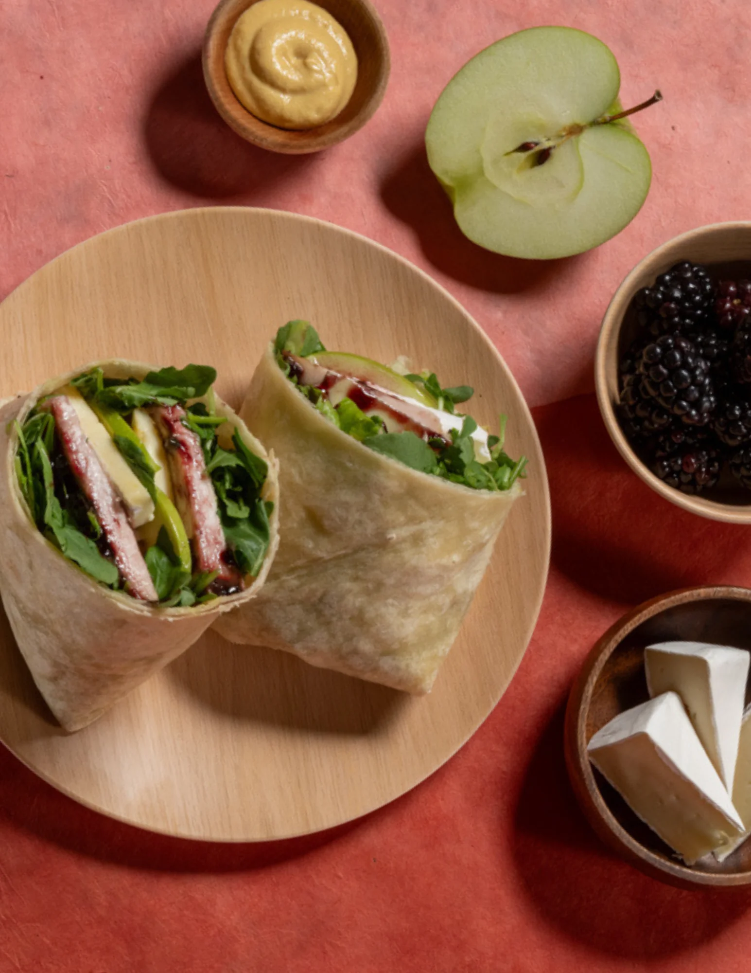 Fresh wrap sandwich with greens and apple slices