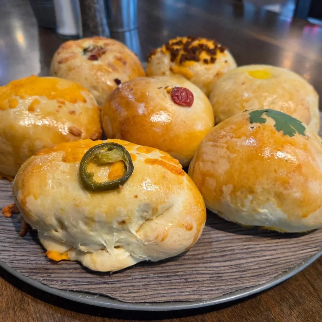 Assorted savory bao buns with colorful toppings