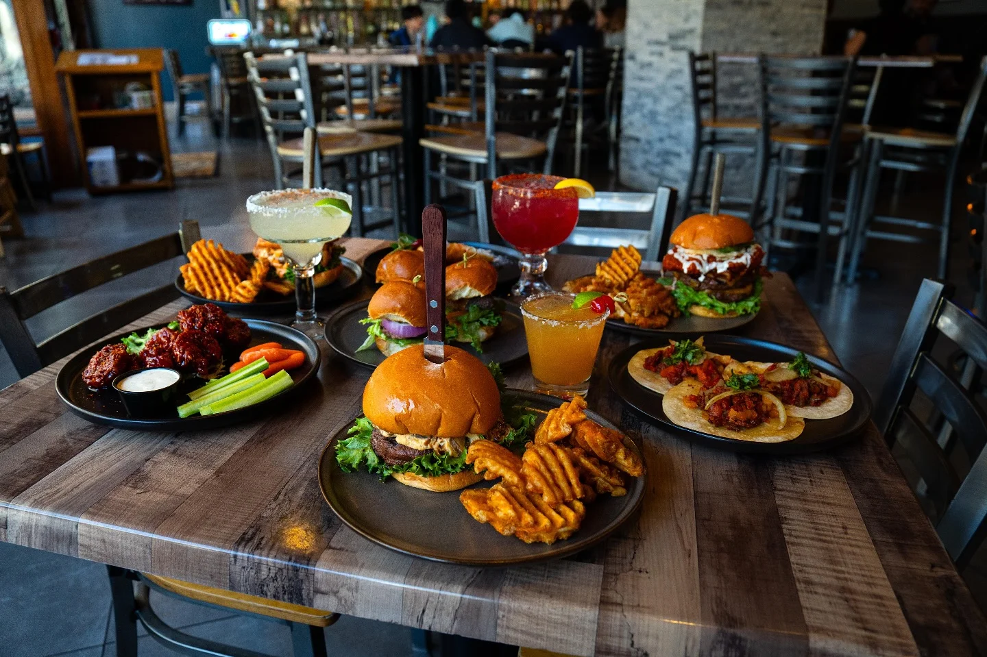 Delicious gourmet burger with fresh toppings on a wooden table
