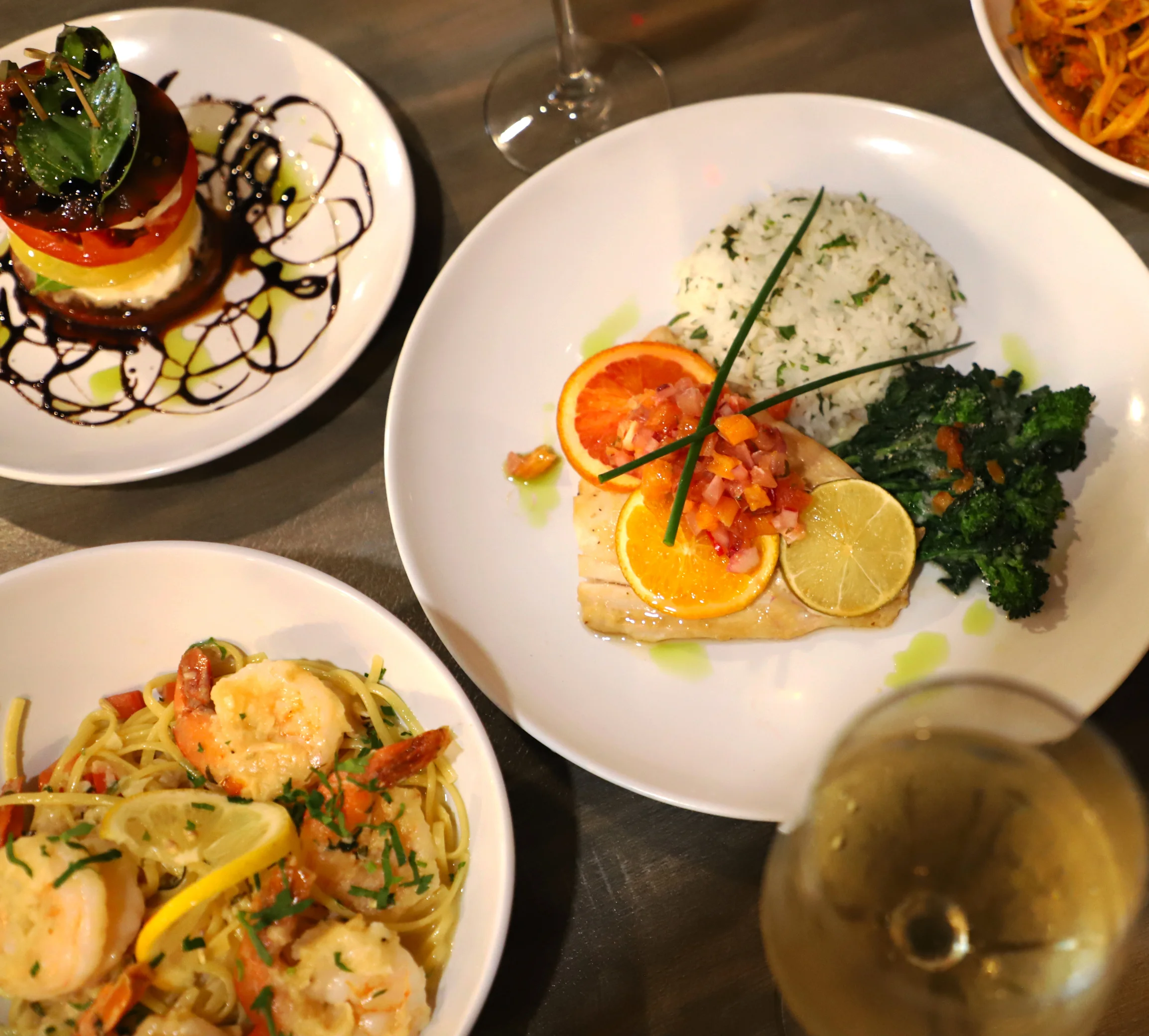 Grilled fish with citrus and rice, served in a contemporary restaurant setting