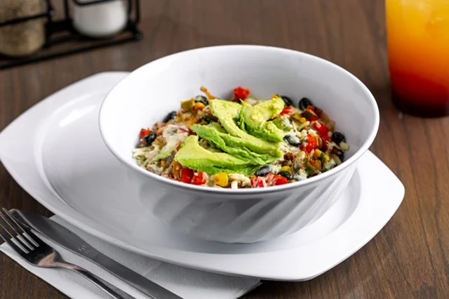 Vibrant Mexican burrito bowl with fresh avocado slices