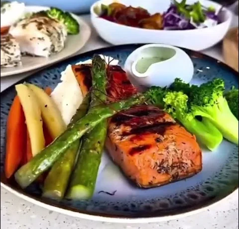Grilled salmon with vegetables on a plate