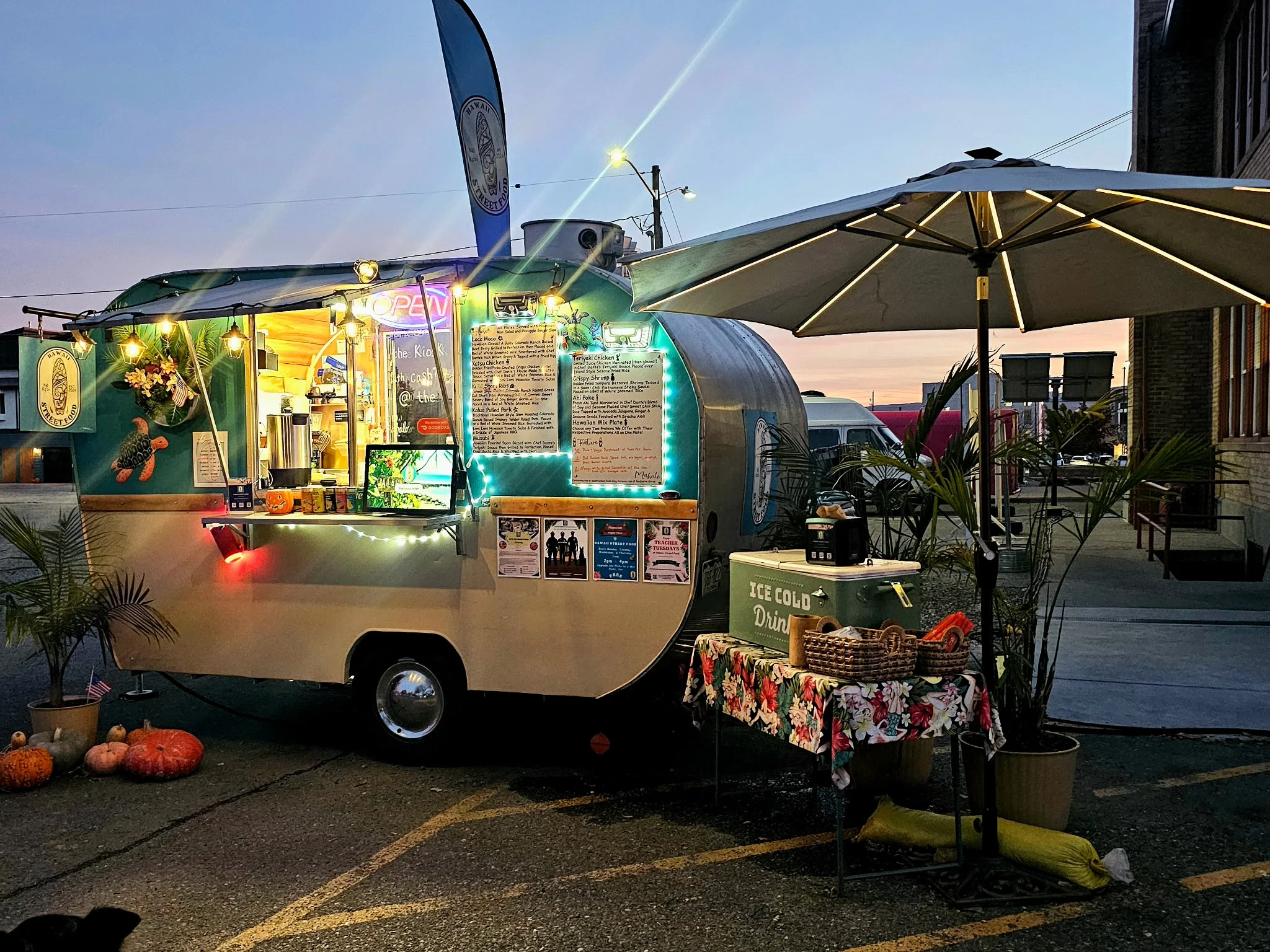 Colorful food truck serving delicious street food at dusk