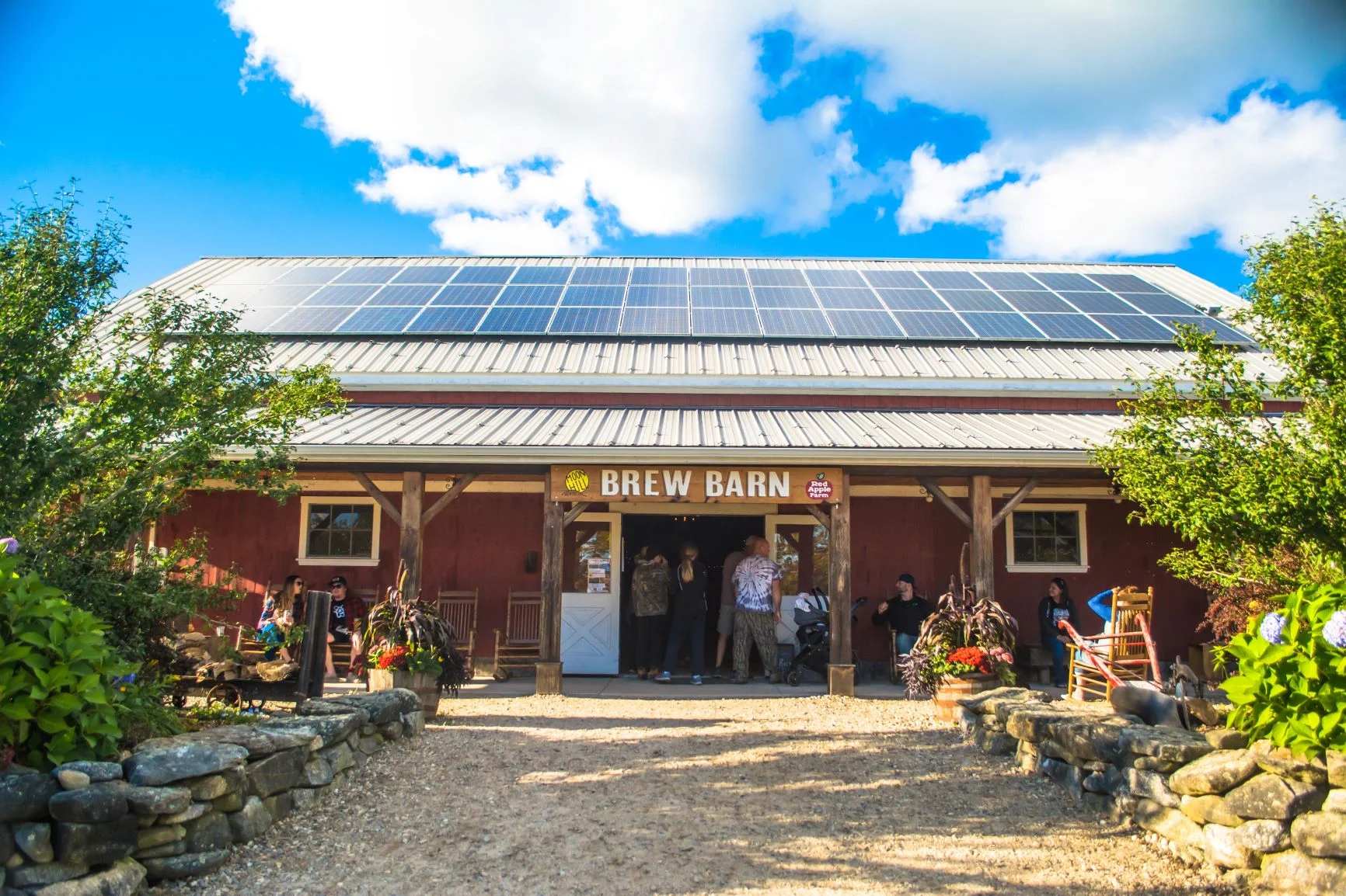 Brew Barn exterior with solar panels and rustic charm