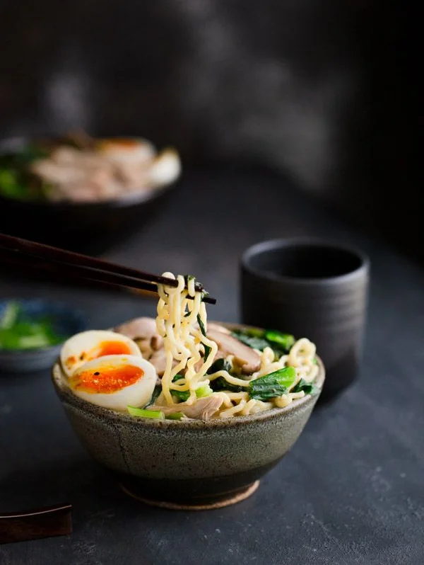 Japanese ramen with soft-boiled egg and greens