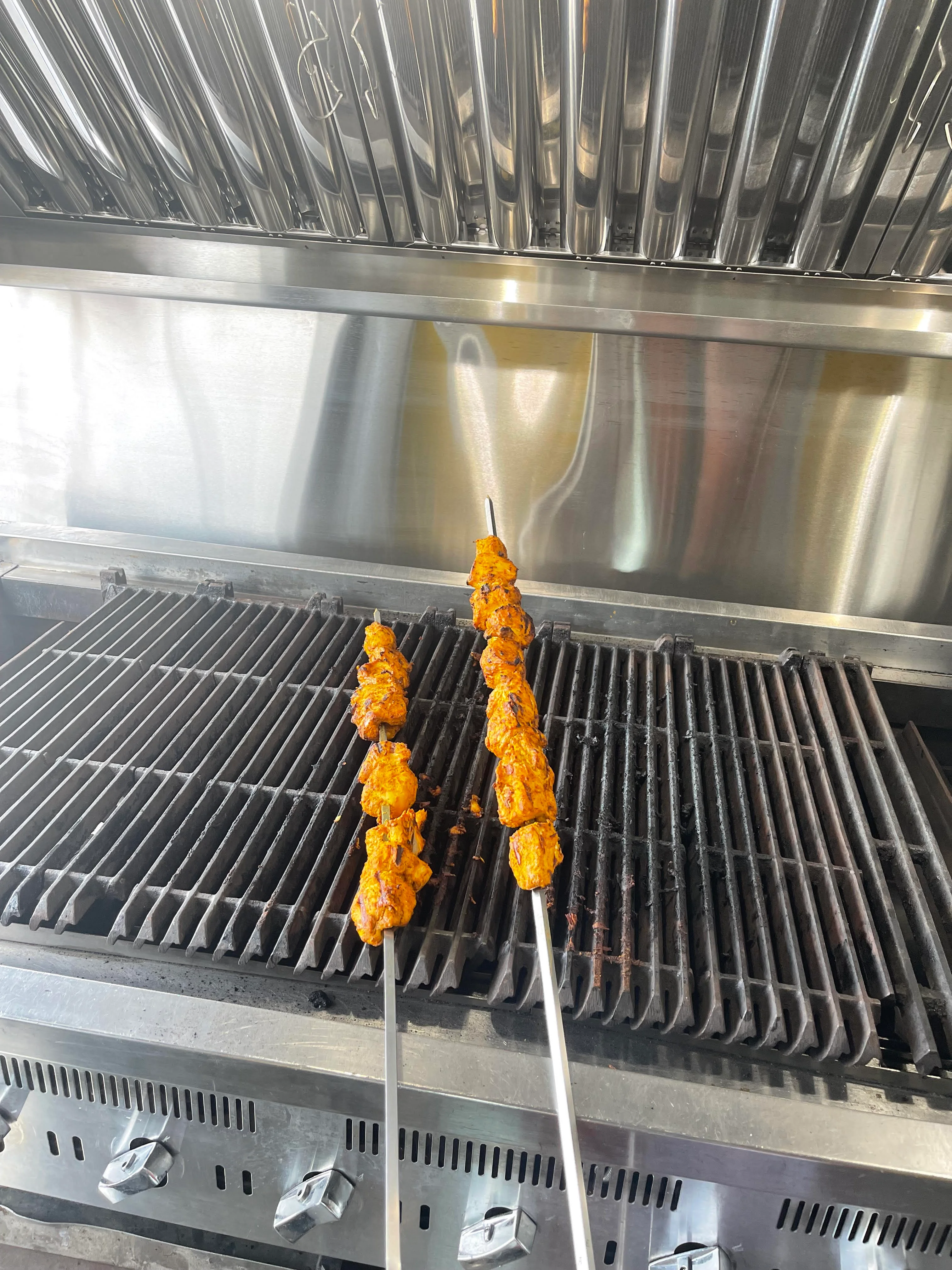 Grilled chicken kebabs on a barbecue grill