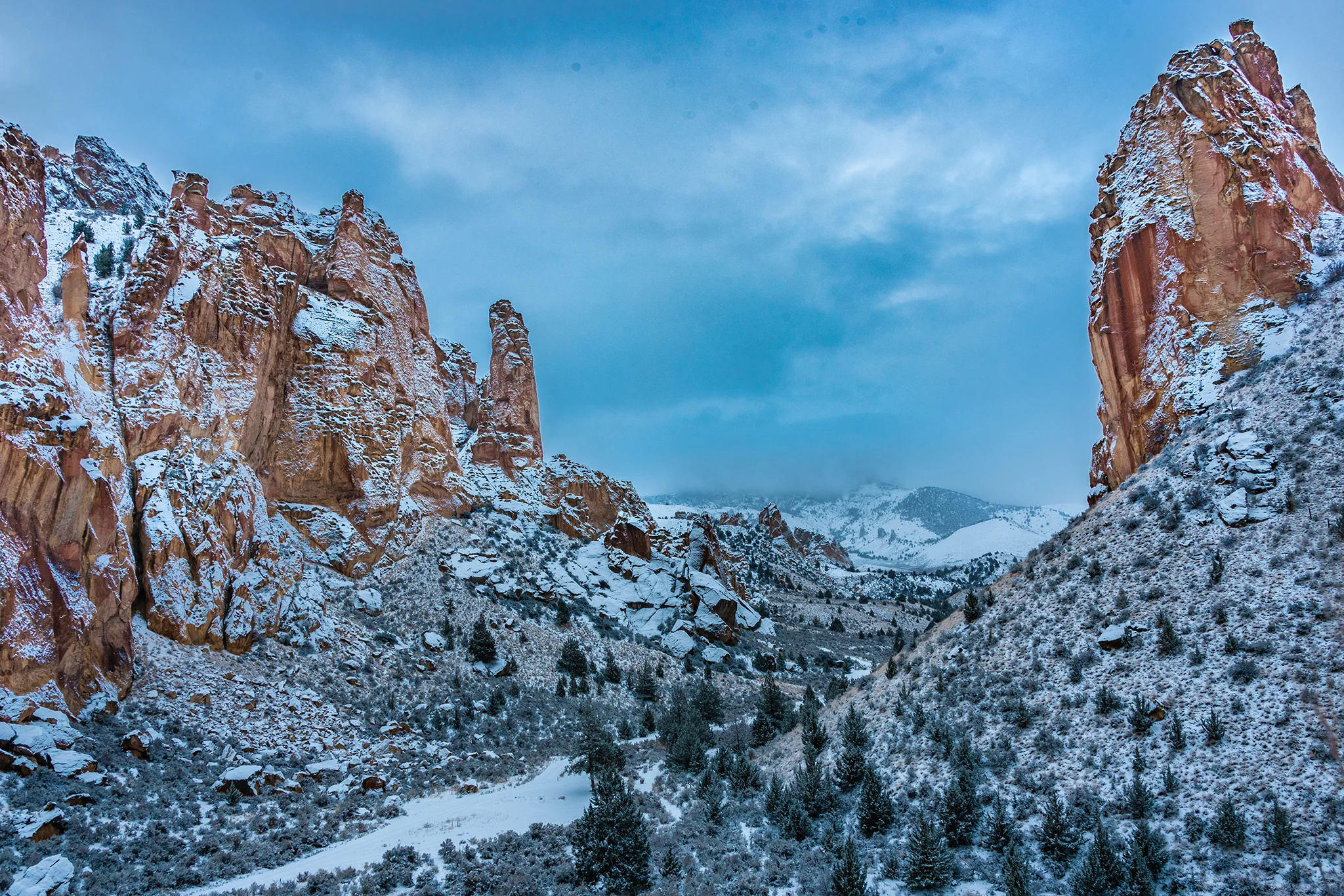 Snow-covered rocky landscape with towering cliffs