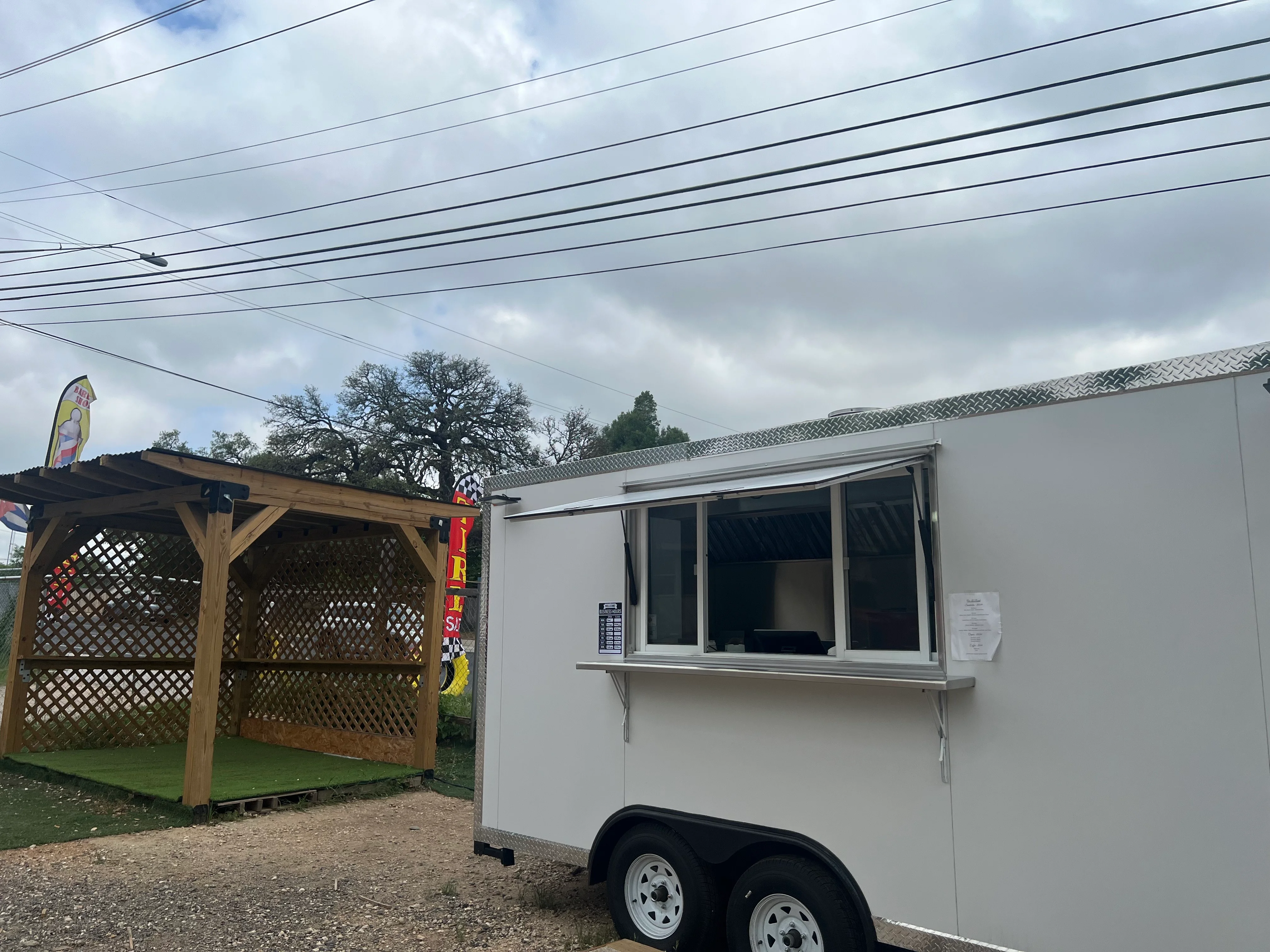 Food truck serving a variety of street food in a casual outdoor setting