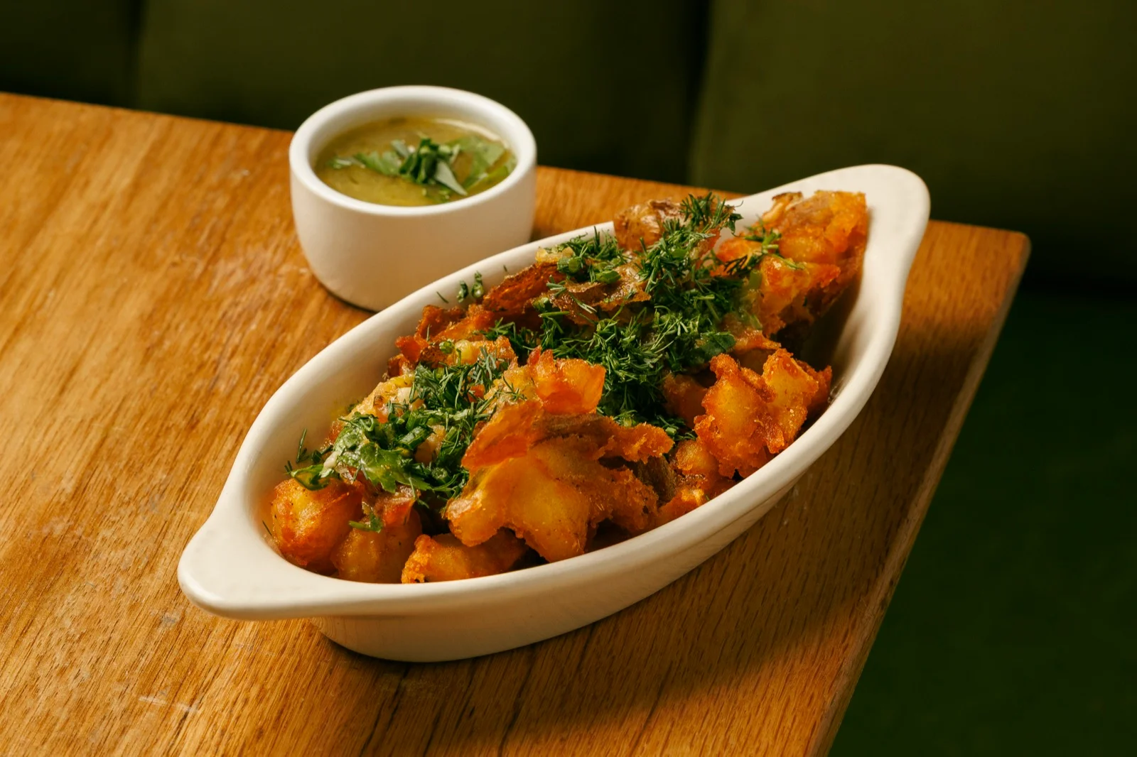 Crispy smashed potatoes with house Tkemali