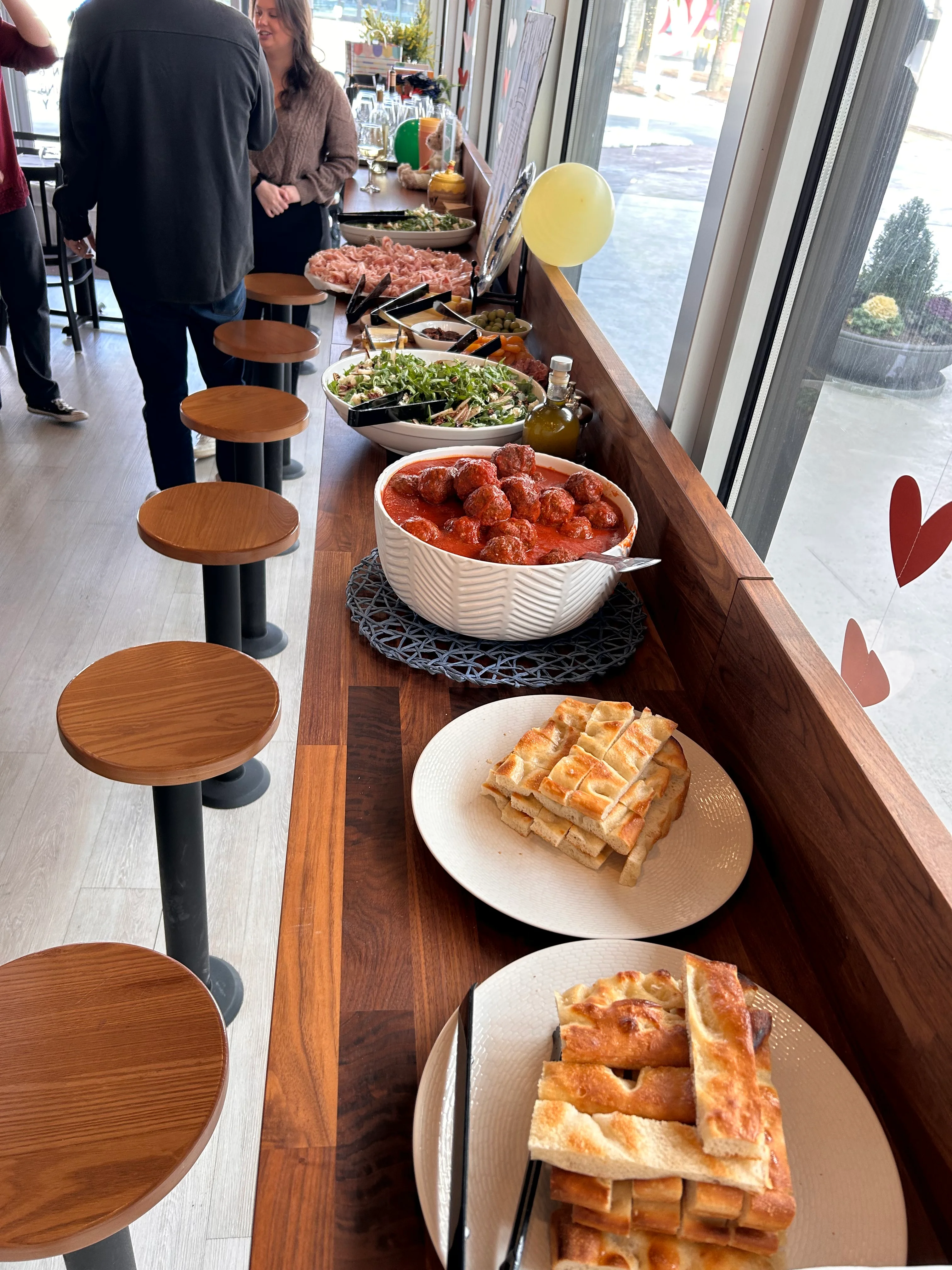 Italian meatballs in marinara sauce served at a casual dining event