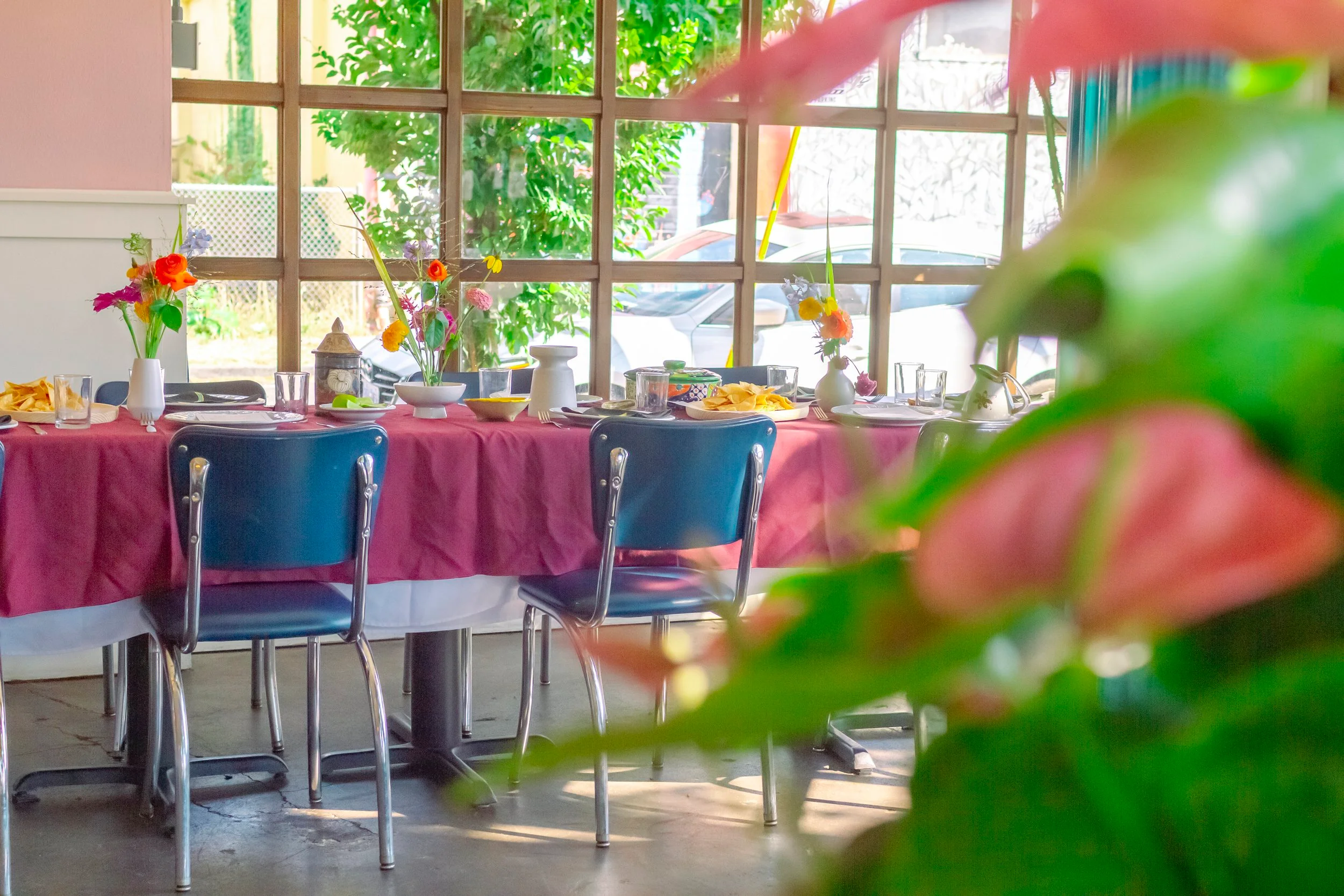 Cozy restaurant dining area with floral centerpieces
