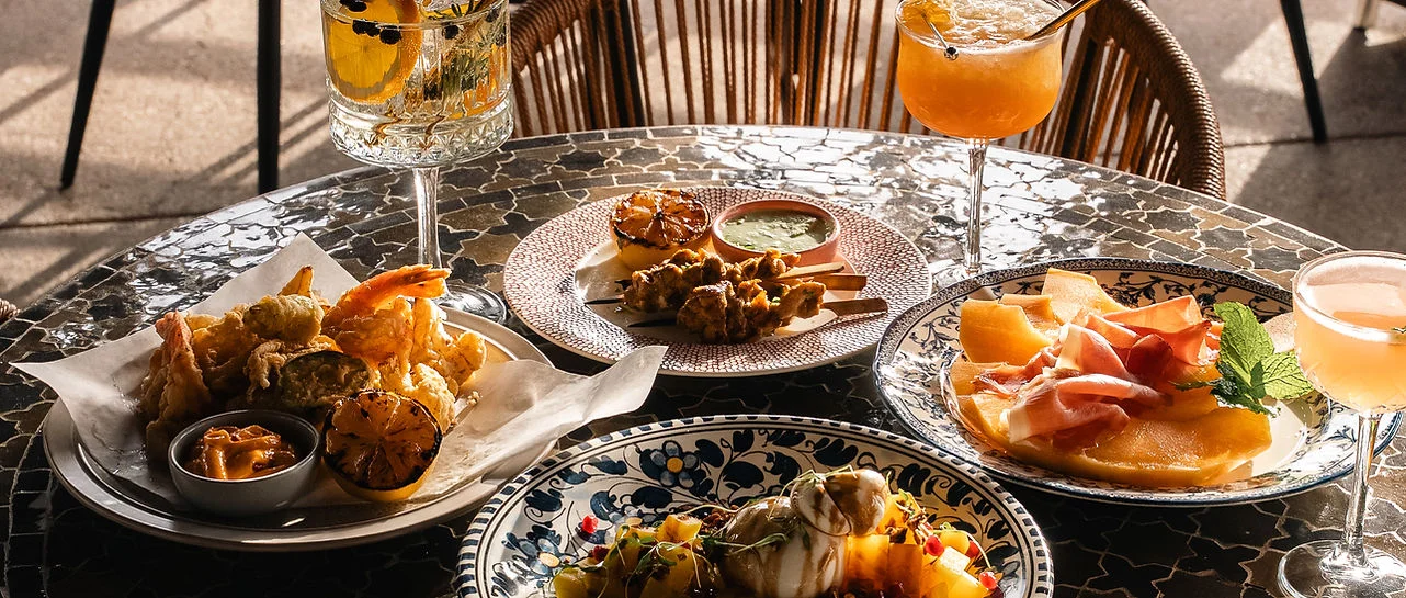 Assorted tapas with cocktails on a stylish table