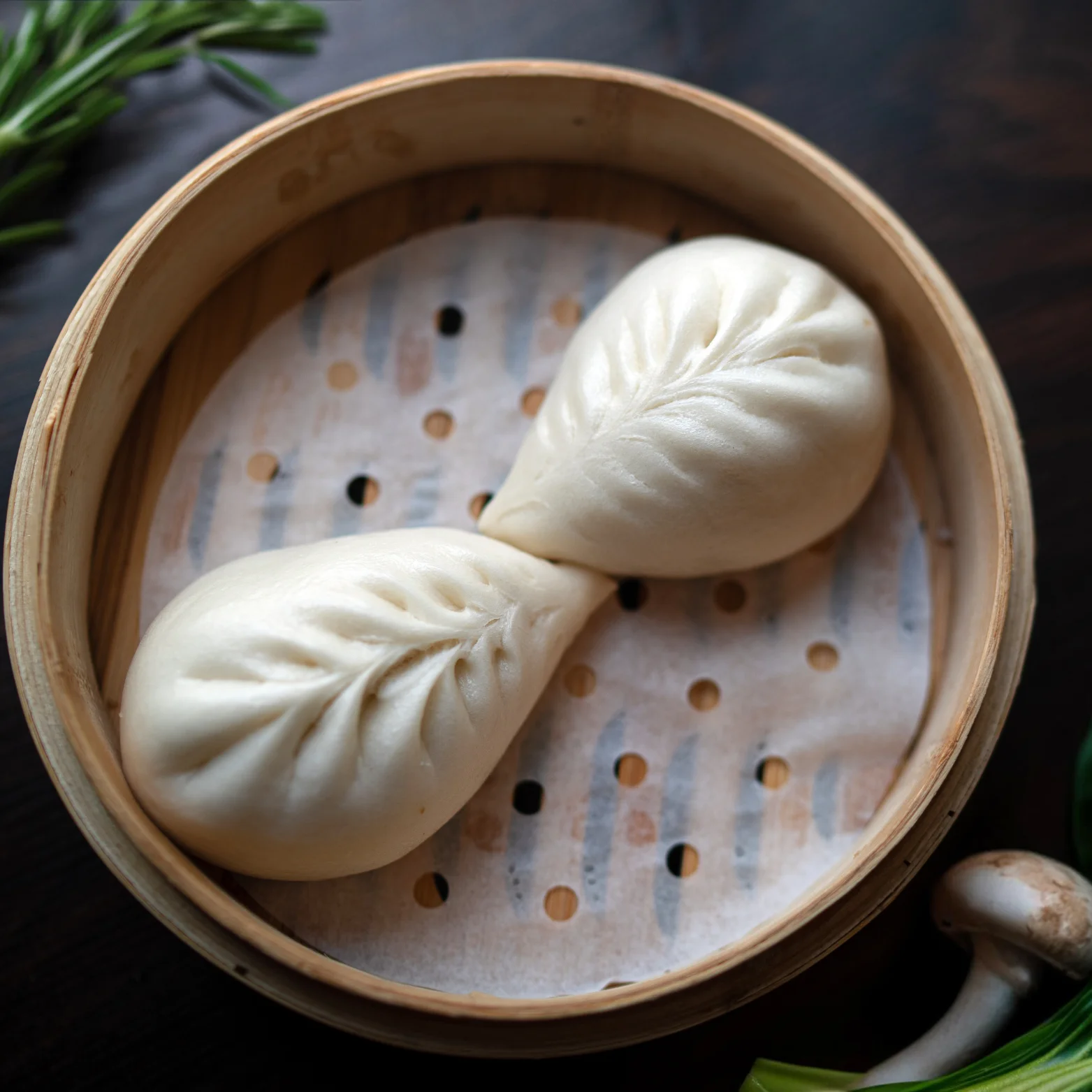 Chinese baozi steamed buns in a bamboo steamer