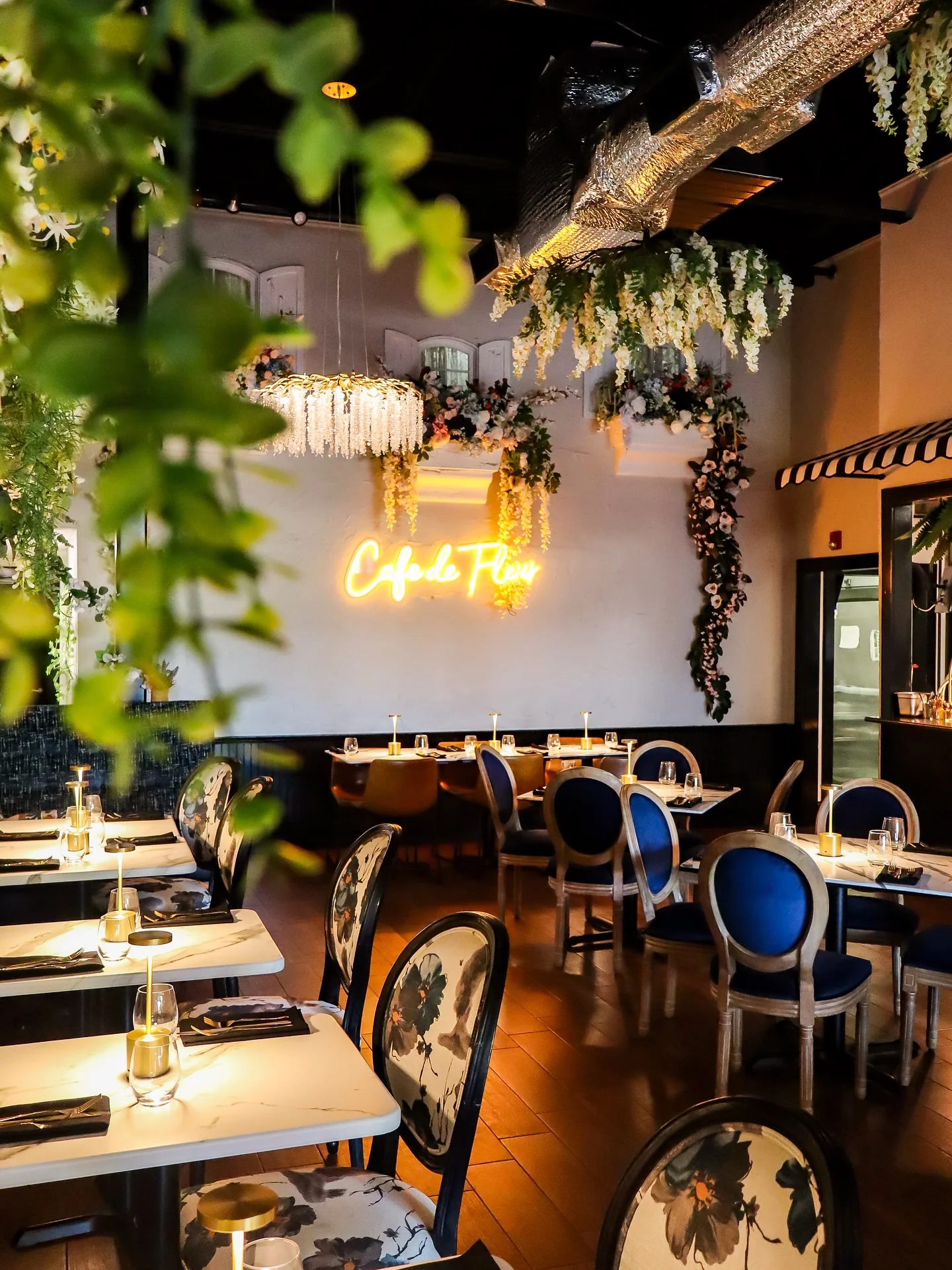 Elegant restaurant interior with floral decor and cozy lighting
