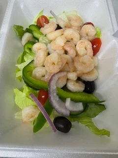 Shrimp salad with fresh greens and vegetables