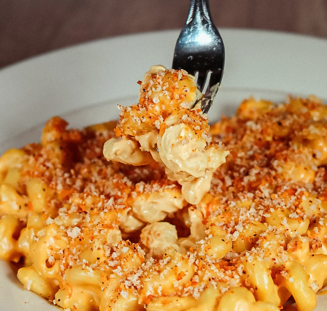 Creamy mac and cheese topped with crispy breadcrumbs