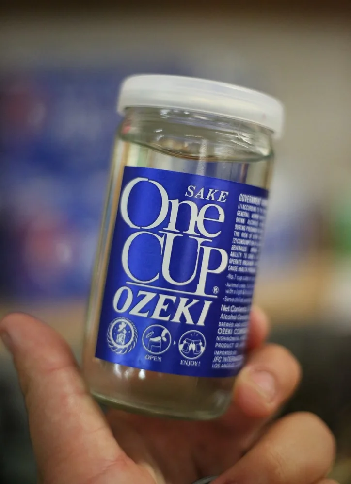 Bottle of Ozeki sake in a glass container