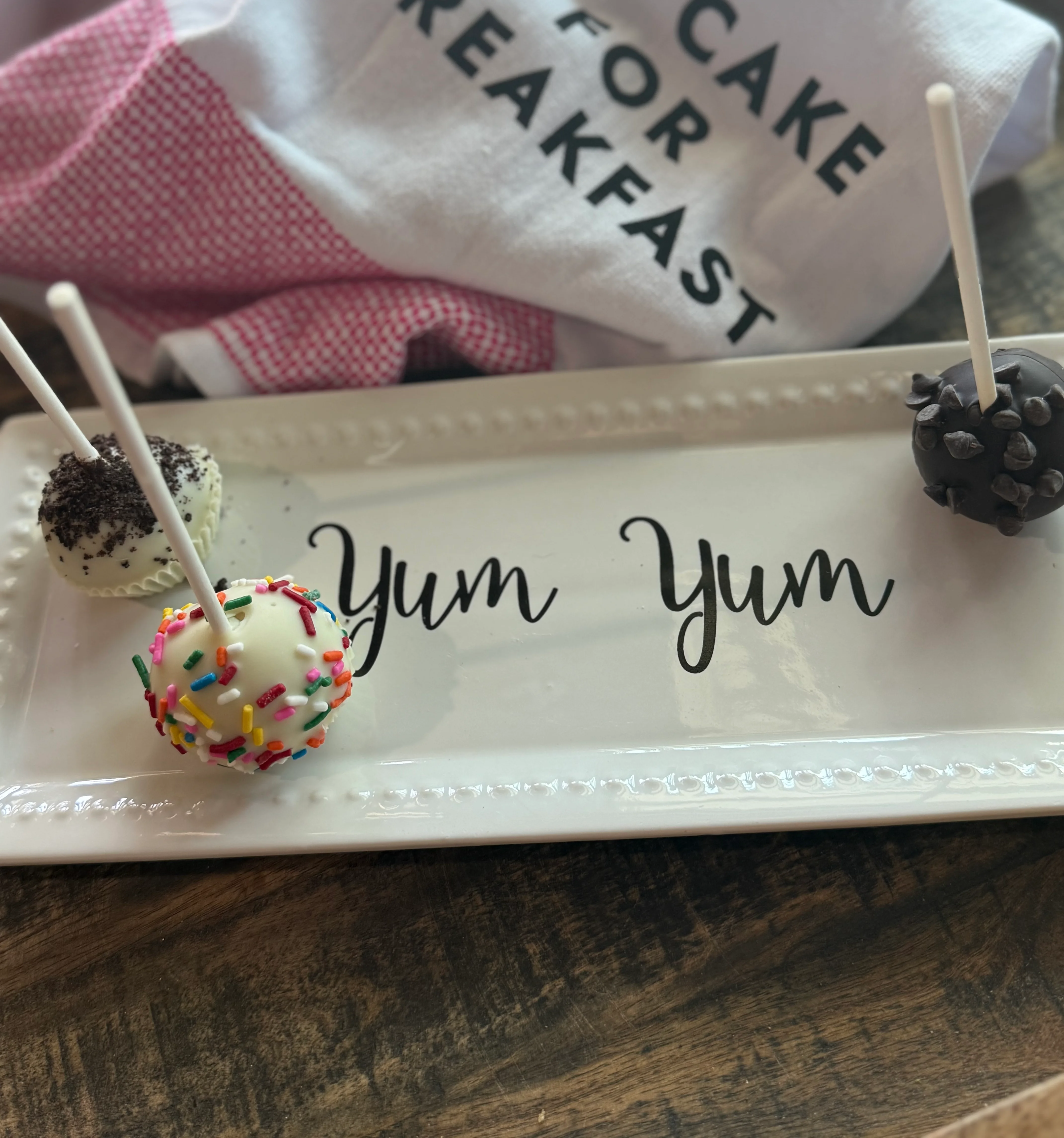 Colorful cake pops arranged on a plate, perfect for breakfast treats.