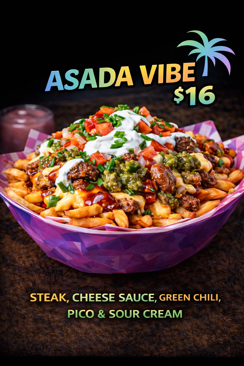 A delicious serving of fries loaded with steak, cheese sauce, green chili, pico de gallo, and sour cream, showcased in a vibrant bowl.