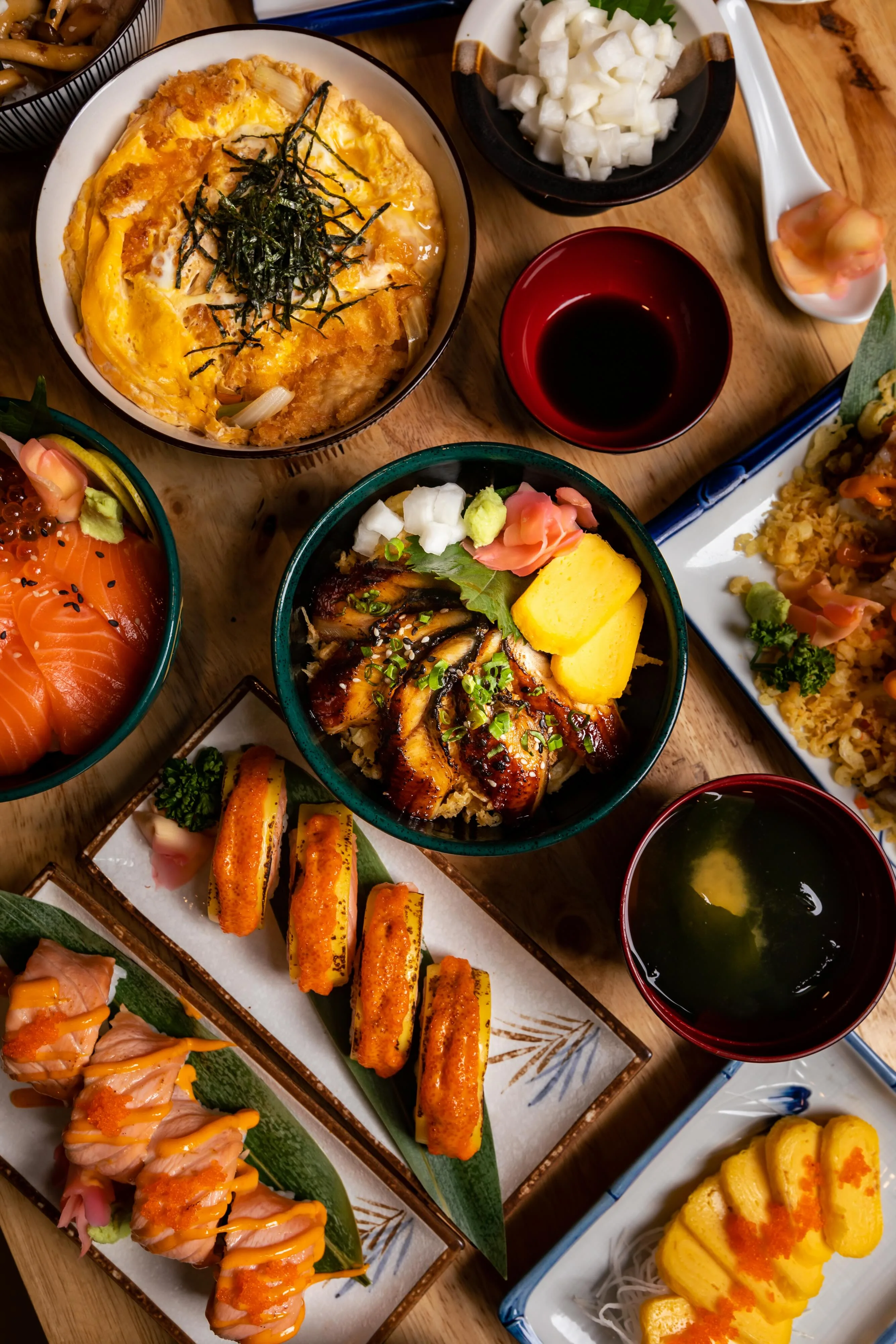 Japanese sushi platter with assorted rolls and donburi